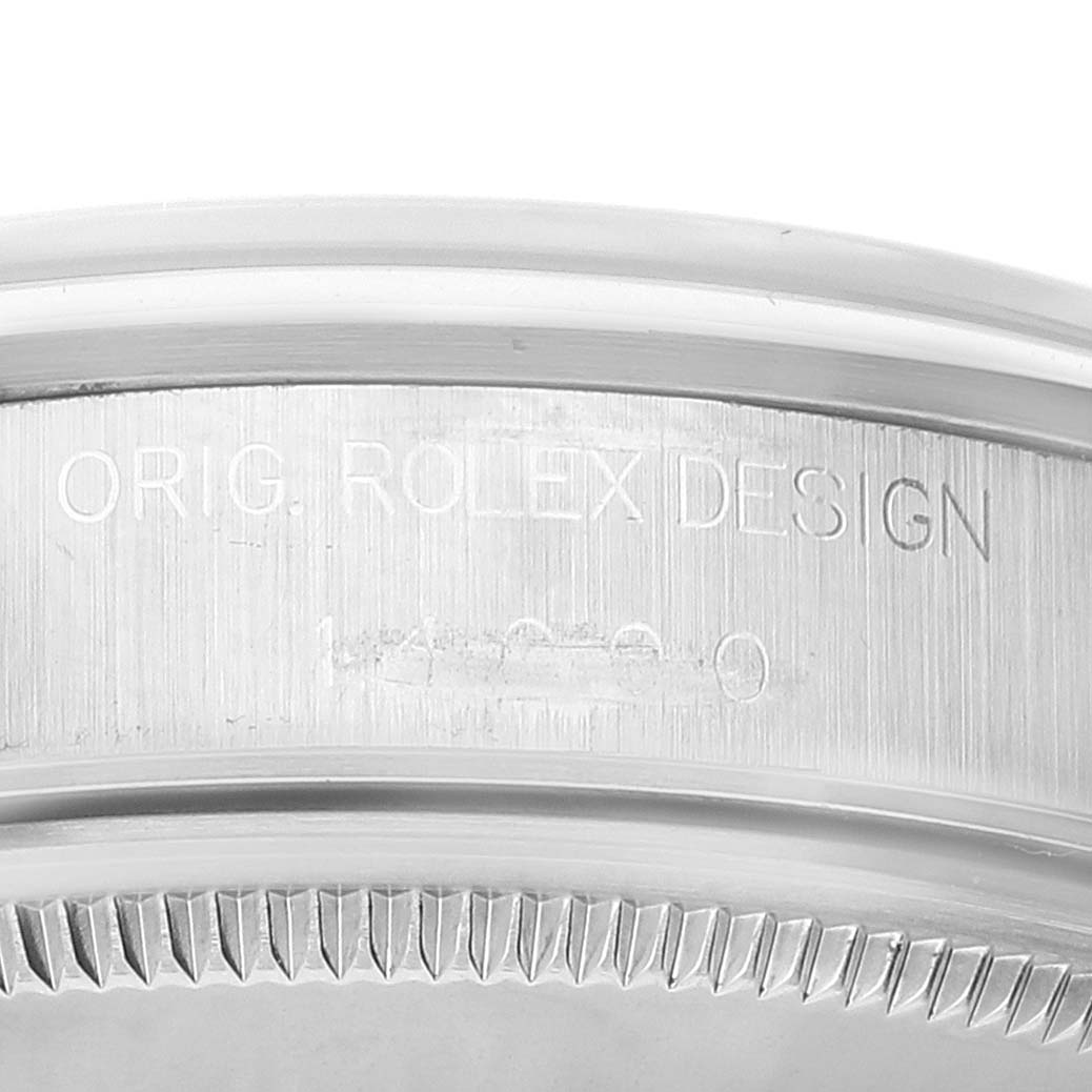 The image shows a close-up of the engraved case edge of a Rolex Air-King 14000 Men's Stainless Steel Pink Dial 14000 Men's Stainless Steel Pink Dial watch.