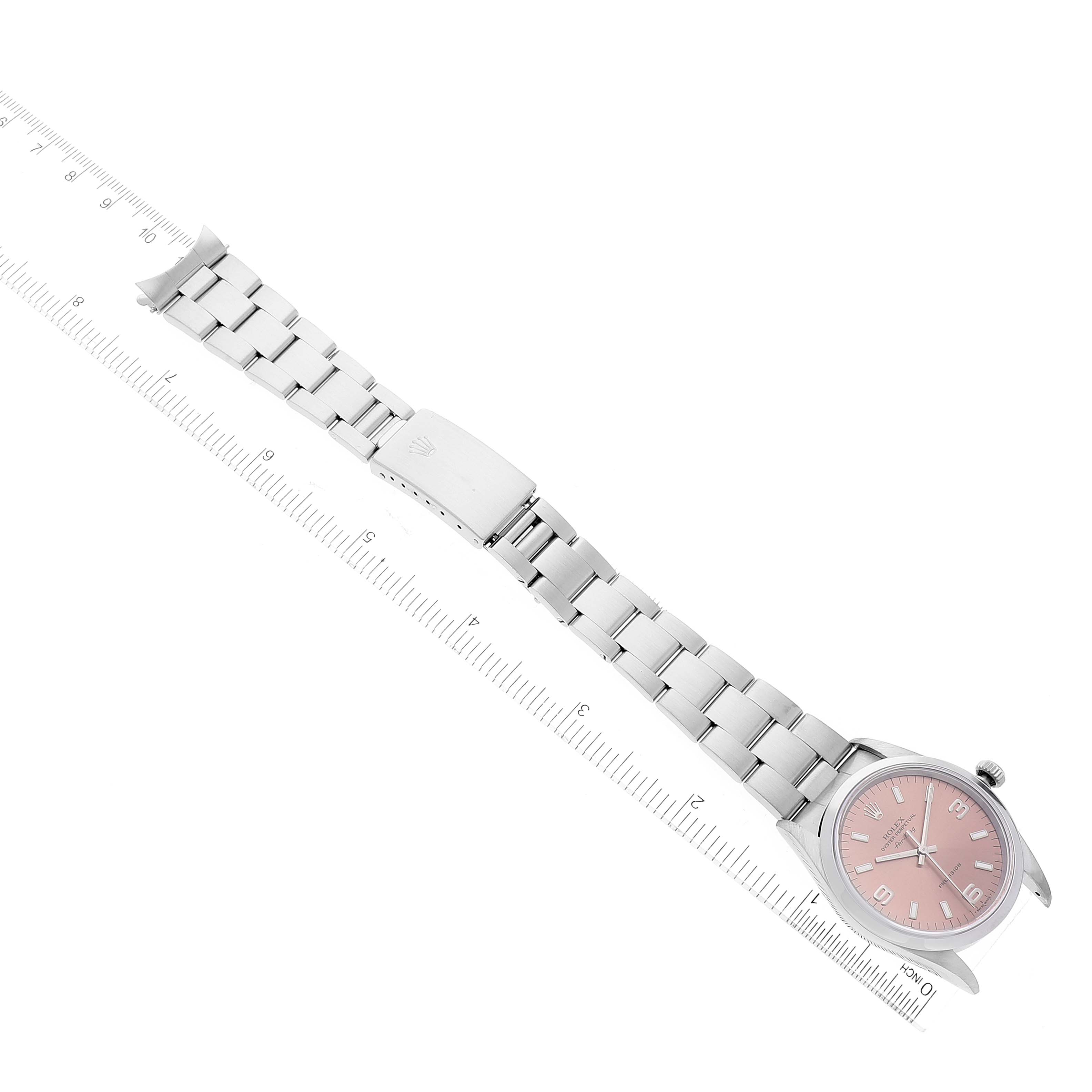 This image shows the Rolex Air-King 14000 Men's Stainless Steel Pink Dial 14000 Men's Stainless Steel Pink Dial watch laid flat with its entire band and face visible, alongside a ruler for scale.