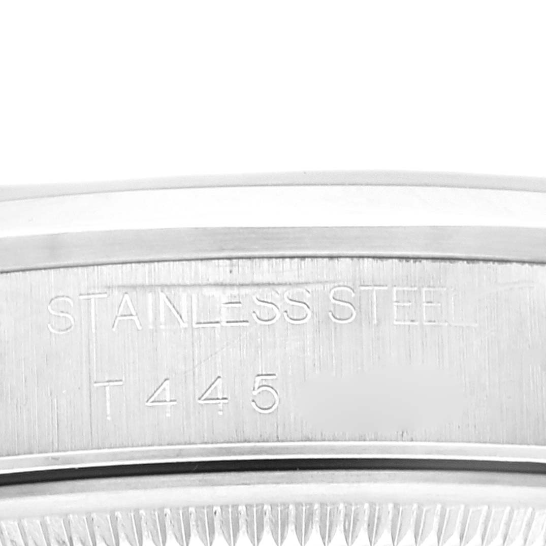 This close-up image shows the side edge with engraved text of a stainless steel Rolex Air-King 14000 Men's Stainless Steel Black Dial 14000 Men's Stainless Steel Black Dial watch case.