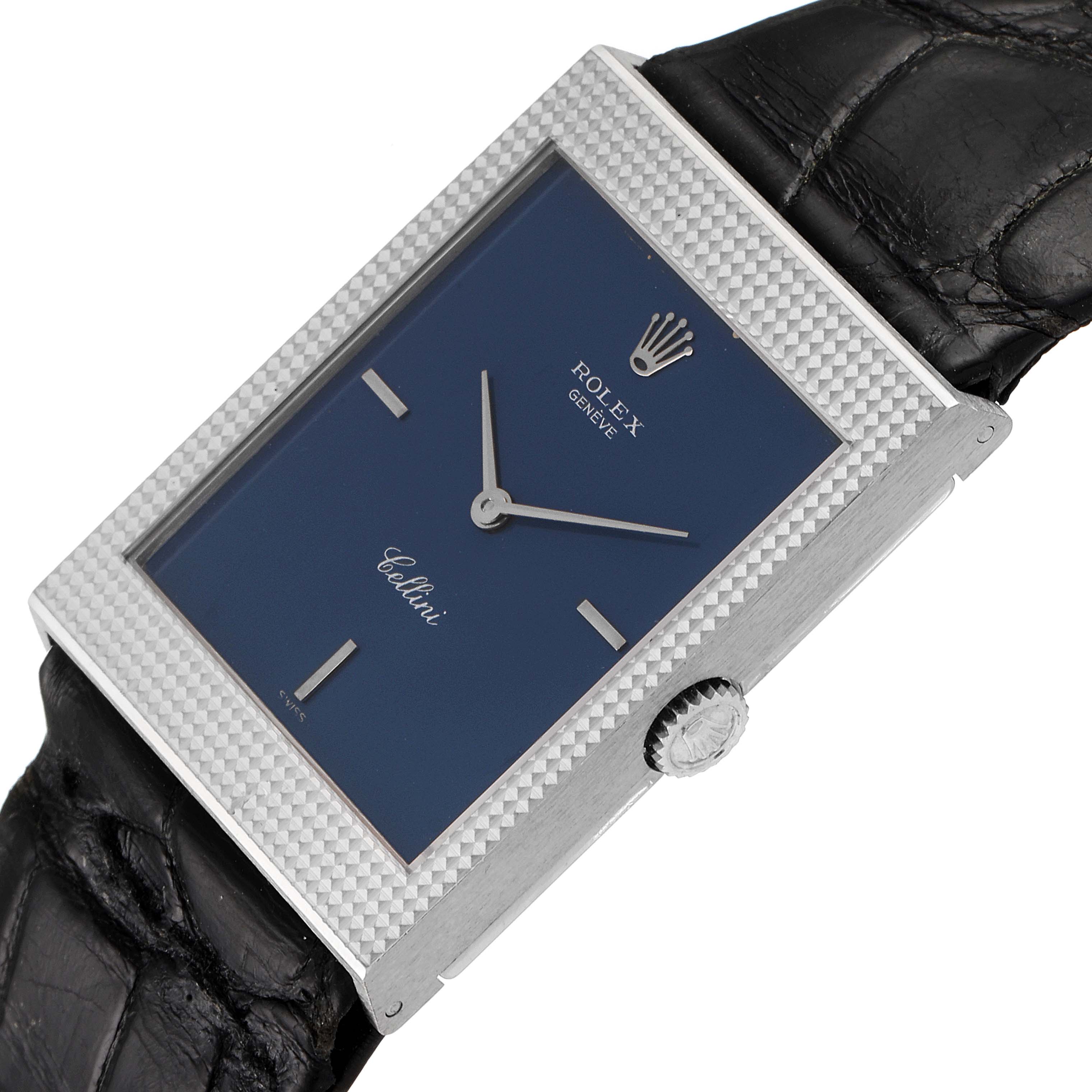 This image shows a close-up angled view of the face and side of the Rolex Cellini 4127 Men
s White Gold Blue Dial 4127 Men
s White Gold Blue Dial watch, featuring its crown and part of its strap.