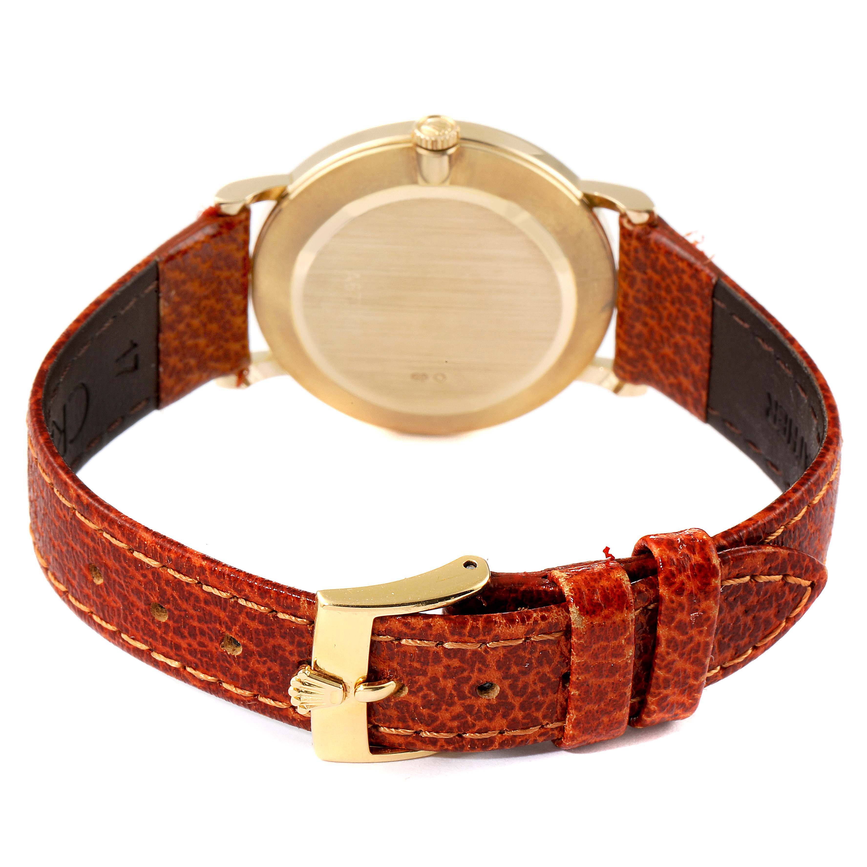 The image shows the back case and leather strap with the buckle of a Rolex Cellini 5112 Men's Yellow Gold White Dial 5112 Men's Yellow Gold White Dial watch.