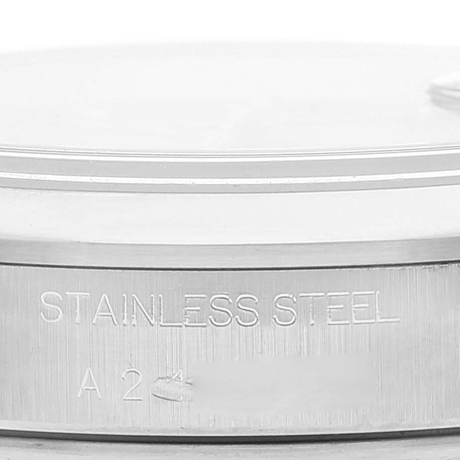 The image shows a close-up of the side of a stainless steel casing for a Rolex Date 15200 Men
s Stainless Steel Pink Dial 15200 Men
s Stainless Steel Pink Dial model watch, highlighting the engravings.