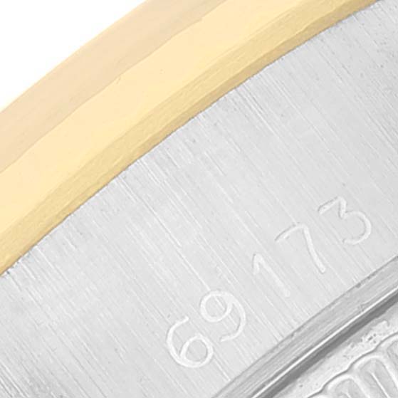 This close-up image shows the model number "69173" engraved on the case of a Rolex Datejust 69173 Women
s Steel and Gold (two tone) Silver Dial 69173 Women
s Steel and Gold (two tone) Silver Dial watch.