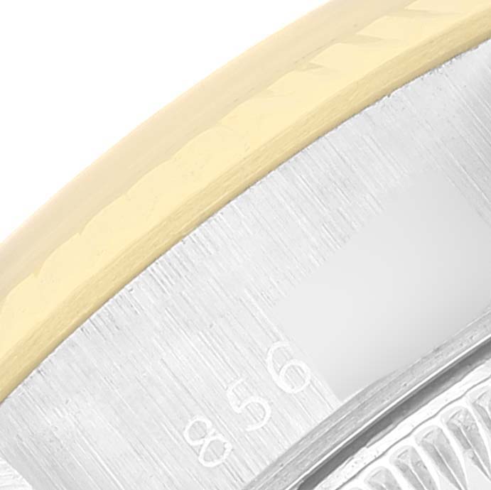 This close-up shows the edge of the bezel and part of the dial of a Rolex Datejust 69173 Women
s Steel and Gold (two tone) Silver Dial 69173 Women
s Steel and Gold (two tone) Silver Dial watch.