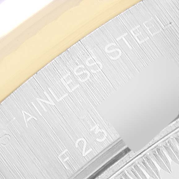 The image shows a close-up of the side case of a Rolex Datejust 79173 Women
s Steel and Gold (two tone) White Dial 79173 Women
s Steel and Gold (two tone) White Dial watch, highlighting the stainless steel material.