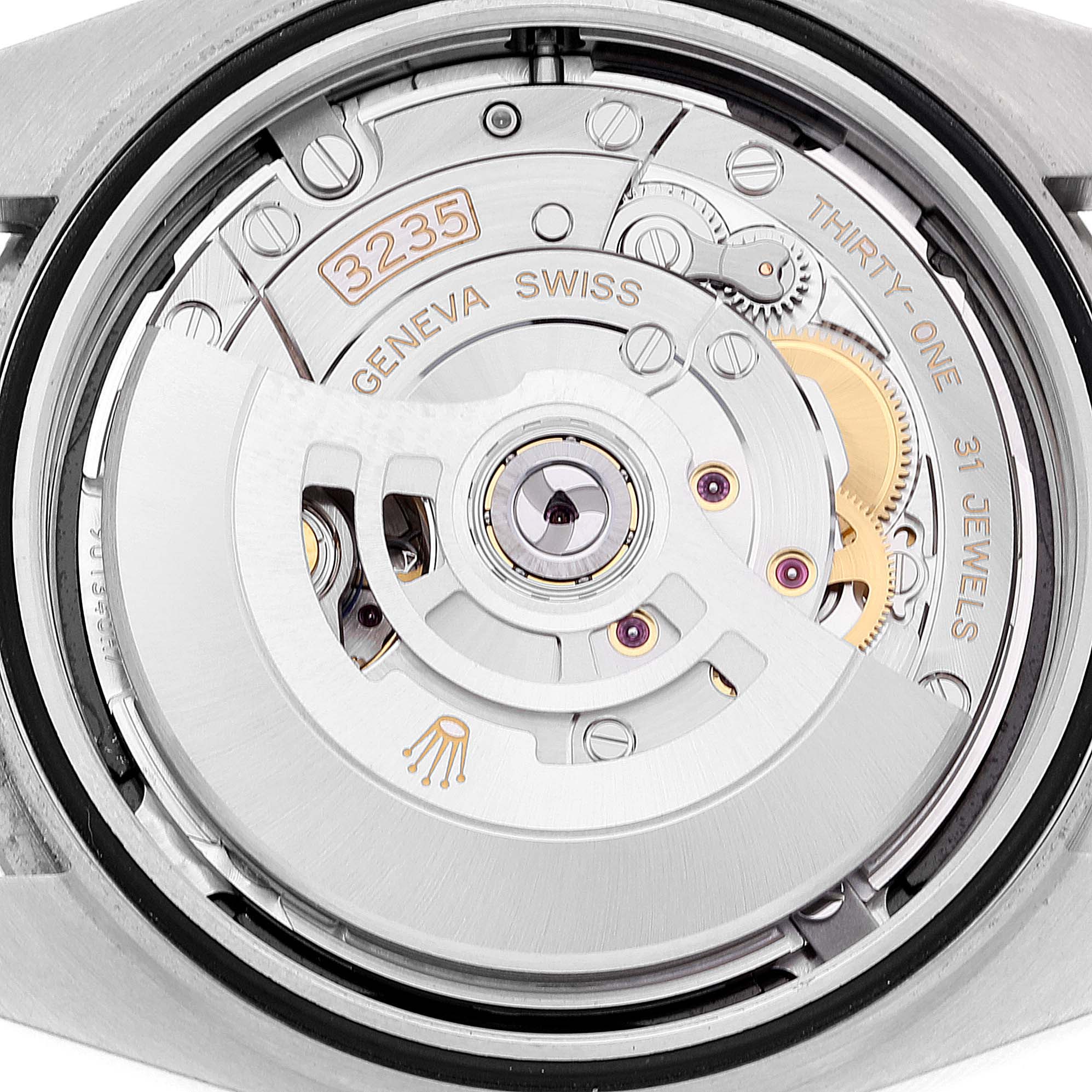 This is an angled close-up of the Datejust 41 Rolex watch, focusing on its intricate movement and internal mechanisms.