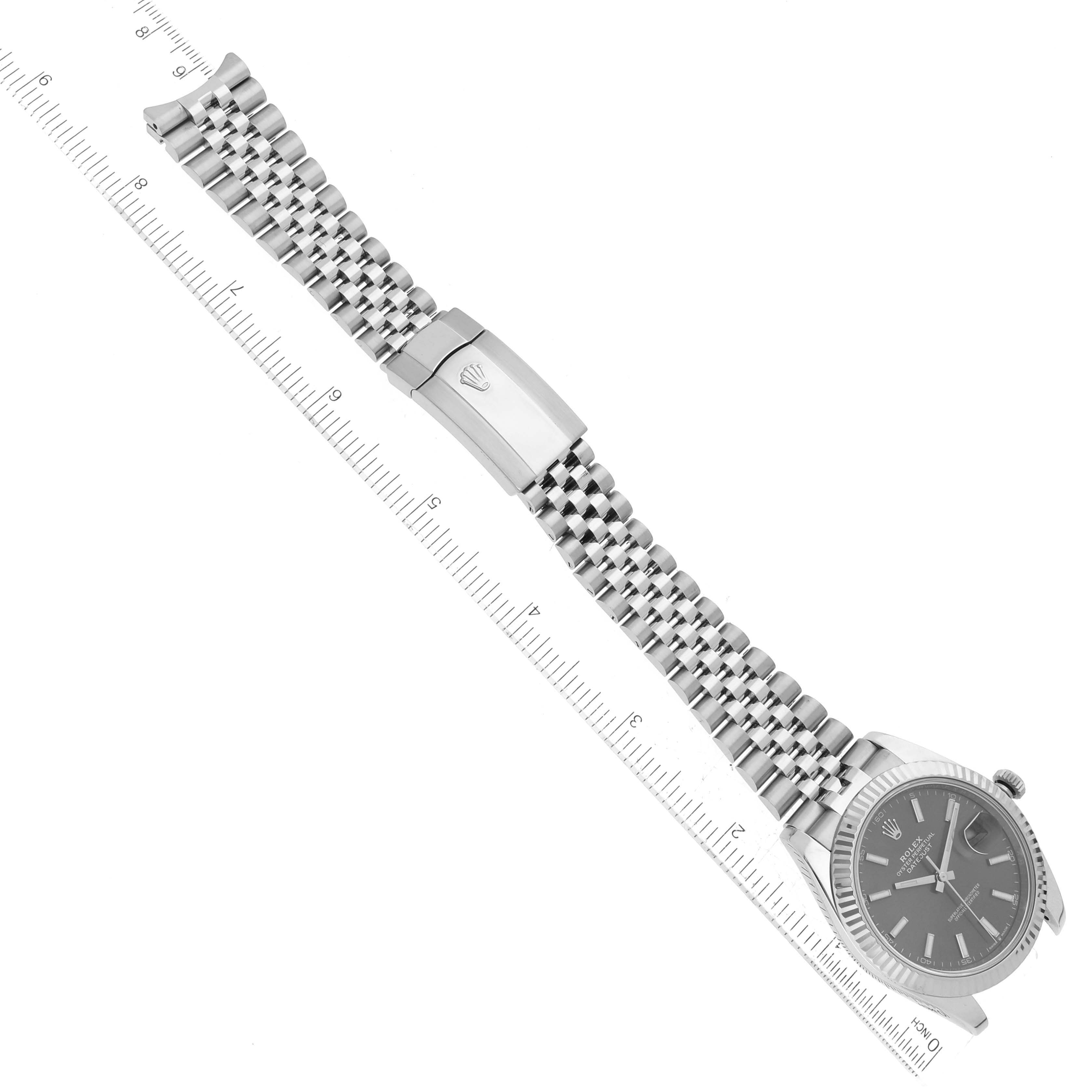 The image shows a Rolex Datejust 41 126334 Men
s Stainless Steel Grey Dial 126334 Men
s Stainless Steel Grey Dial watch laid flat displaying the bracelet, clasp, and partially the dial from a top-down view.