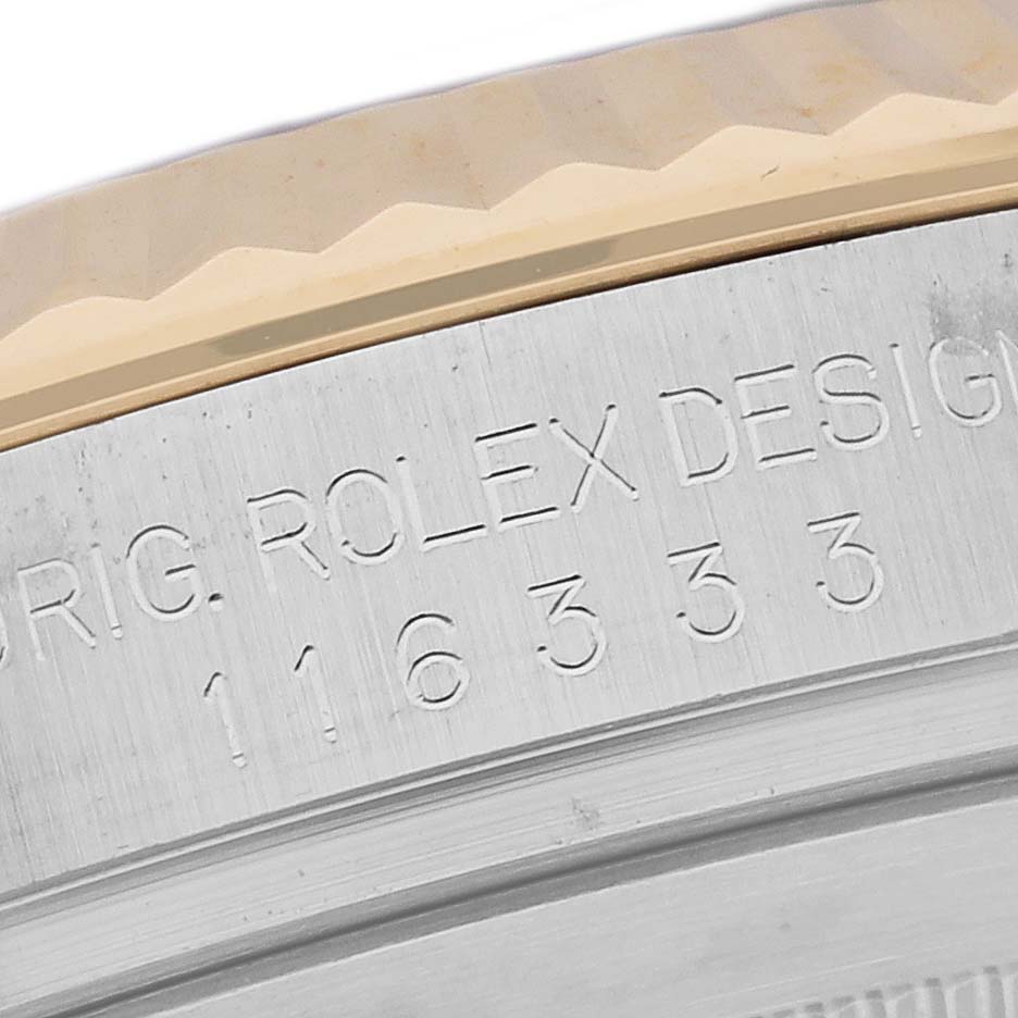 This close-up image shows the engraved side of the Rolex Datejust 41 116333 Men's Steel and Gold (two tone) Grey Dial 116333 Men's Steel and Gold (two tone) Grey Dial, highlighting the model number and "Rolex Design" inscription.
