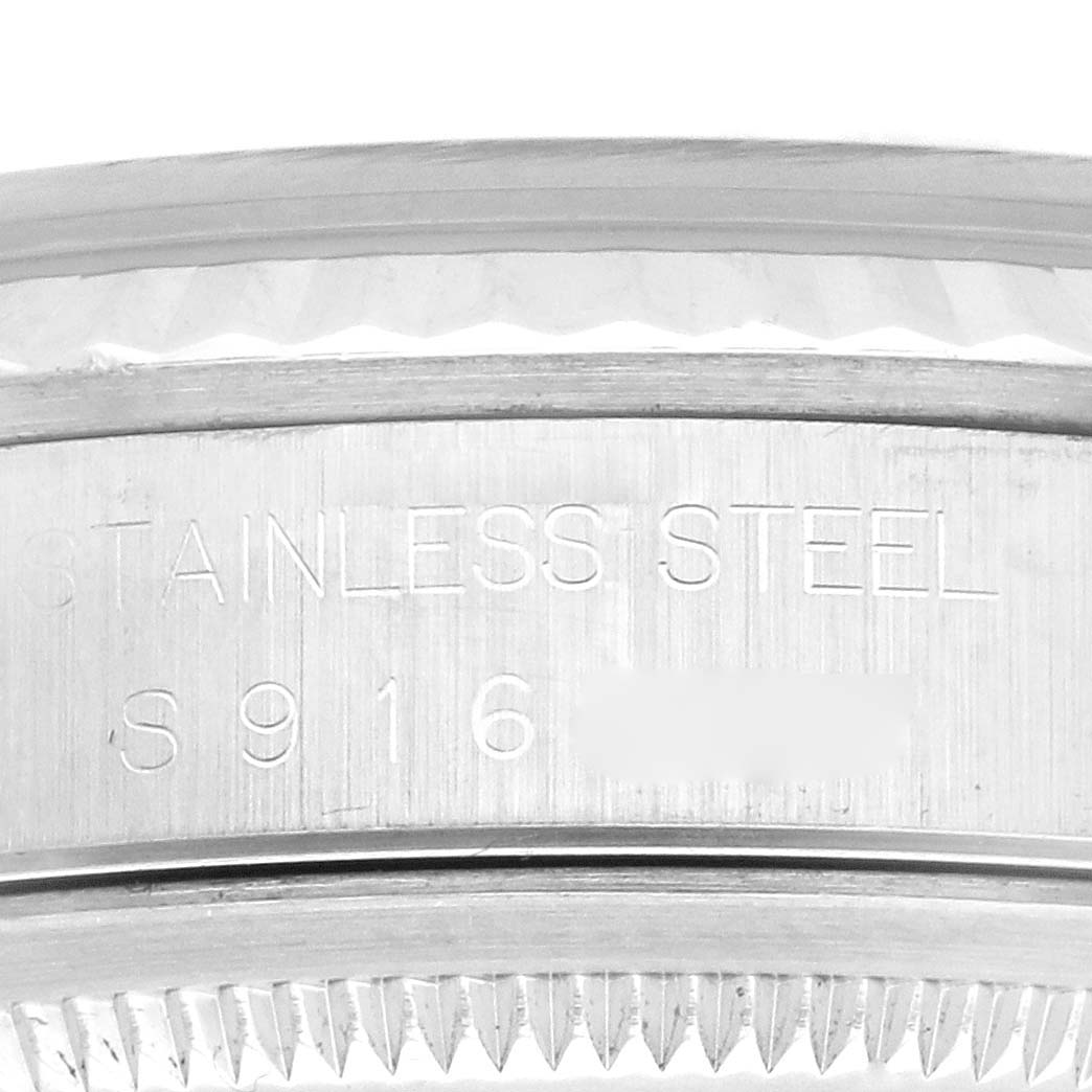 Close-up view of the case engraving and part of the bezel on a Rolex Datejust 16234 Men's Stainless Steel Black Dial 16234 Men's Stainless Steel Black Dial watch.