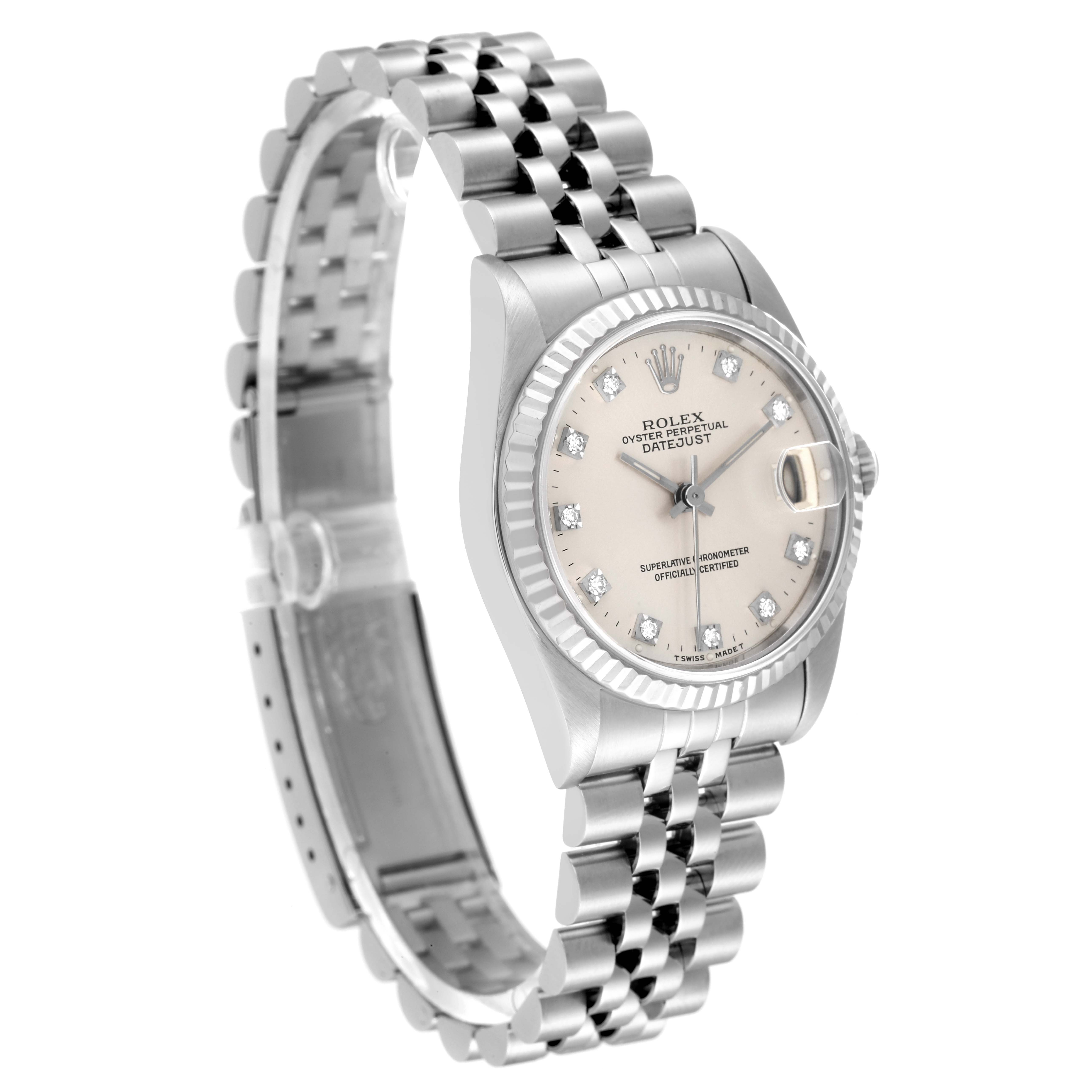 The image shows a Mid-Size Rolex Datejust watch from an angled perspective, highlighting the bezel, dial, bracelet, and clasp.