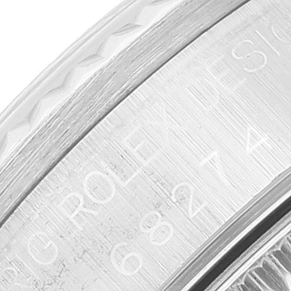 This close-up image shows the engraved edge of a Mid-Size Rolex watch case.