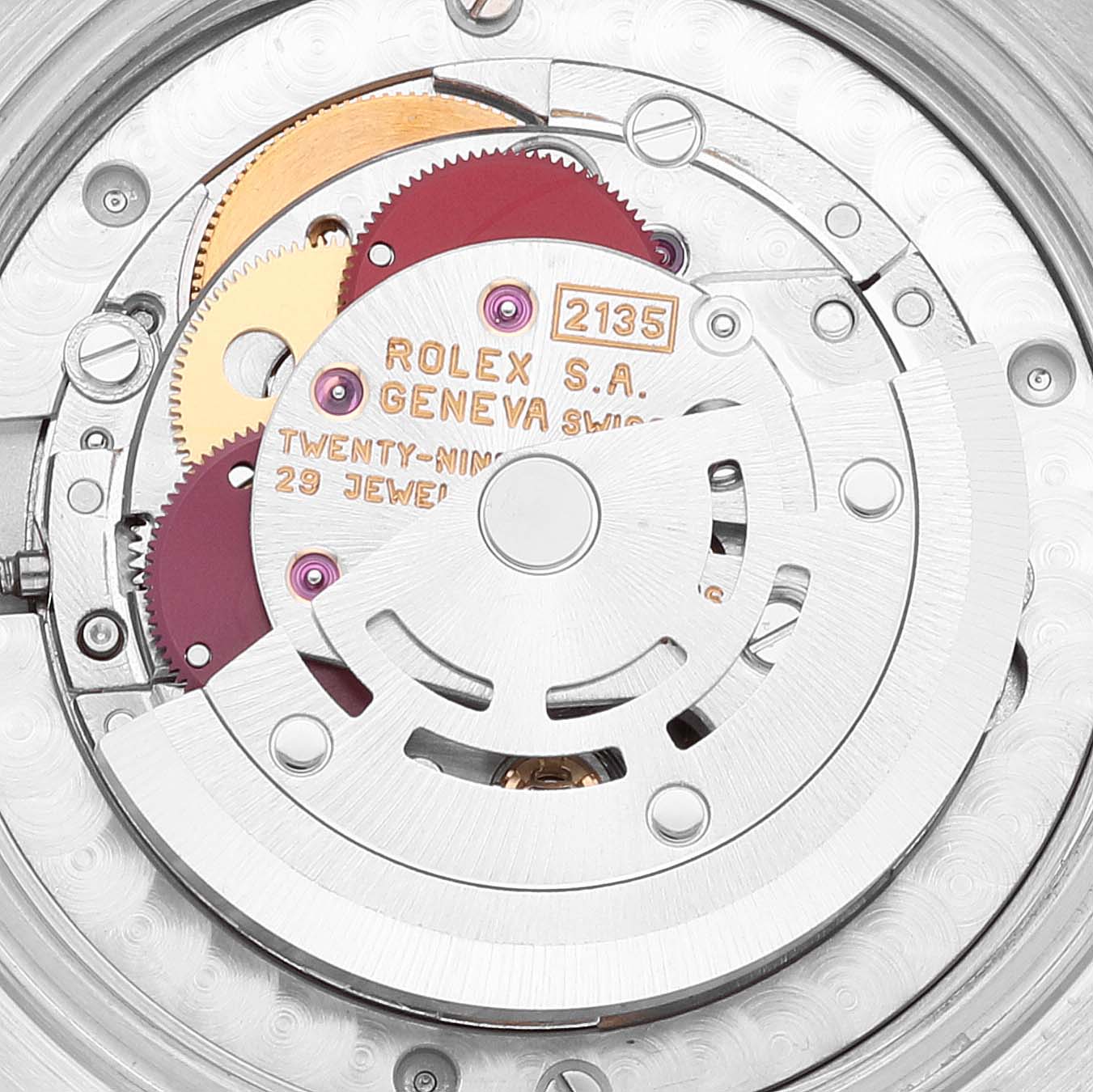 The image shows the internal mechanism of a Rolex Mid-Size 68274 Women's Stainless Steel Silver Dial 68274 Women's Stainless Steel Silver Dial watch, focusing on its intricate gears and movement parts.