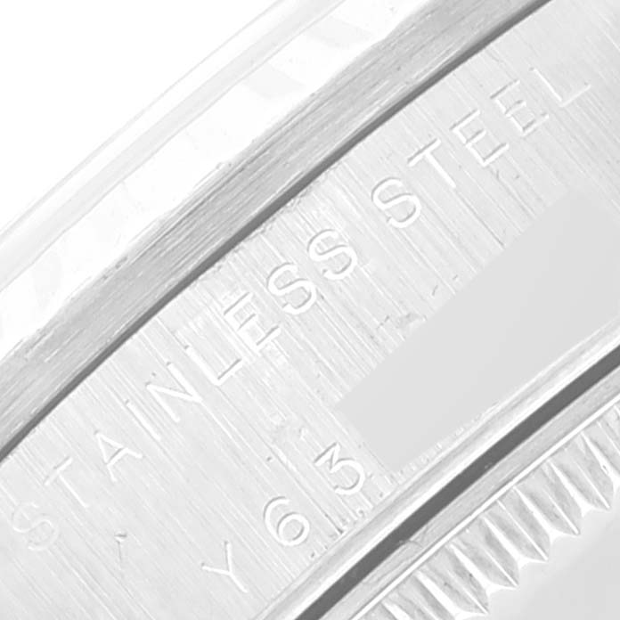 This image shows a close-up of the stainless steel case back of a Rolex Mid-Size 78274 Women's Stainless Steel Mother of Pearl Dial 78274 Women's Stainless Steel Mother of Pearl Dial model watch with some inscriptions visible.