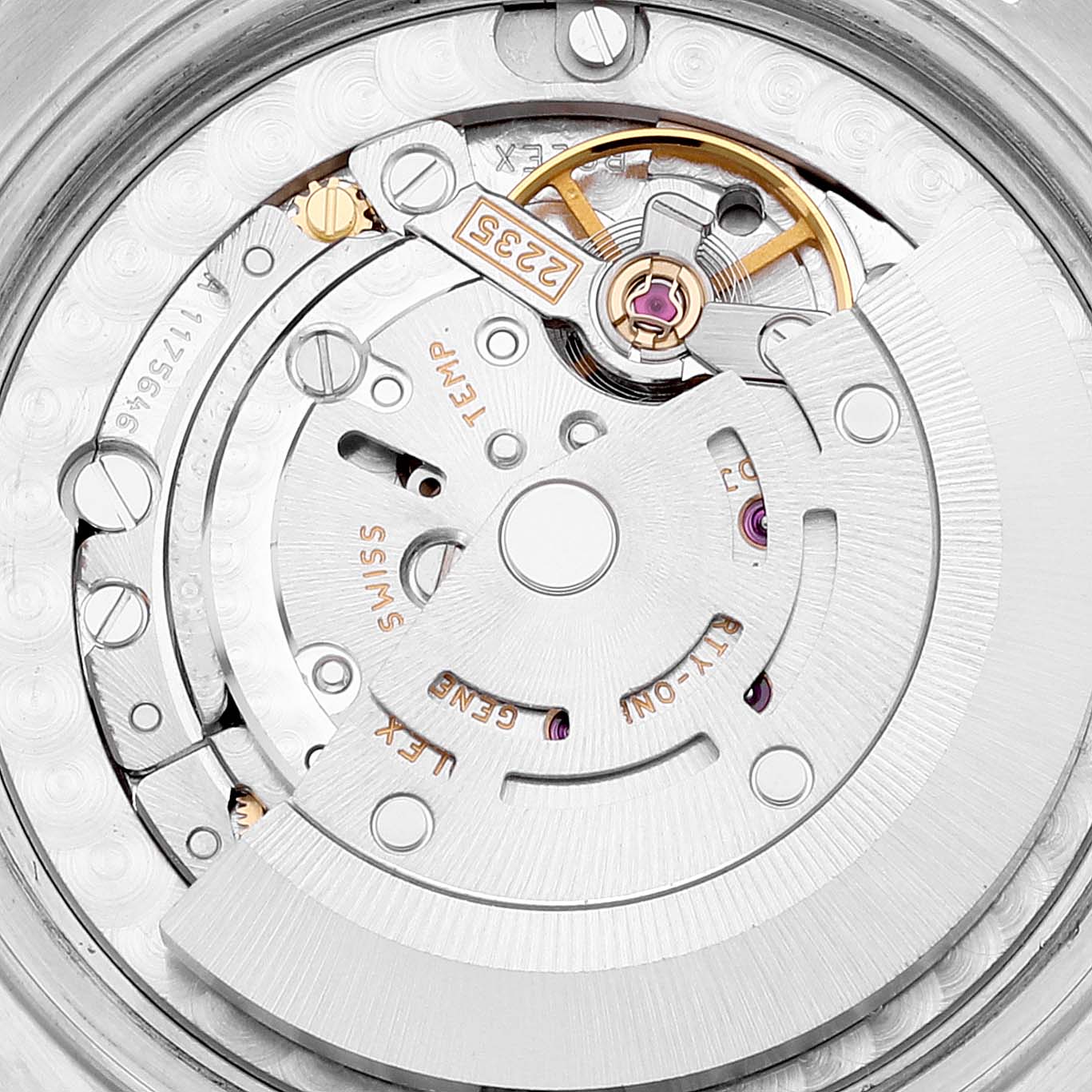 The image shows a close-up of the internal movement mechanism of a Mid-Size Rolex watch.
