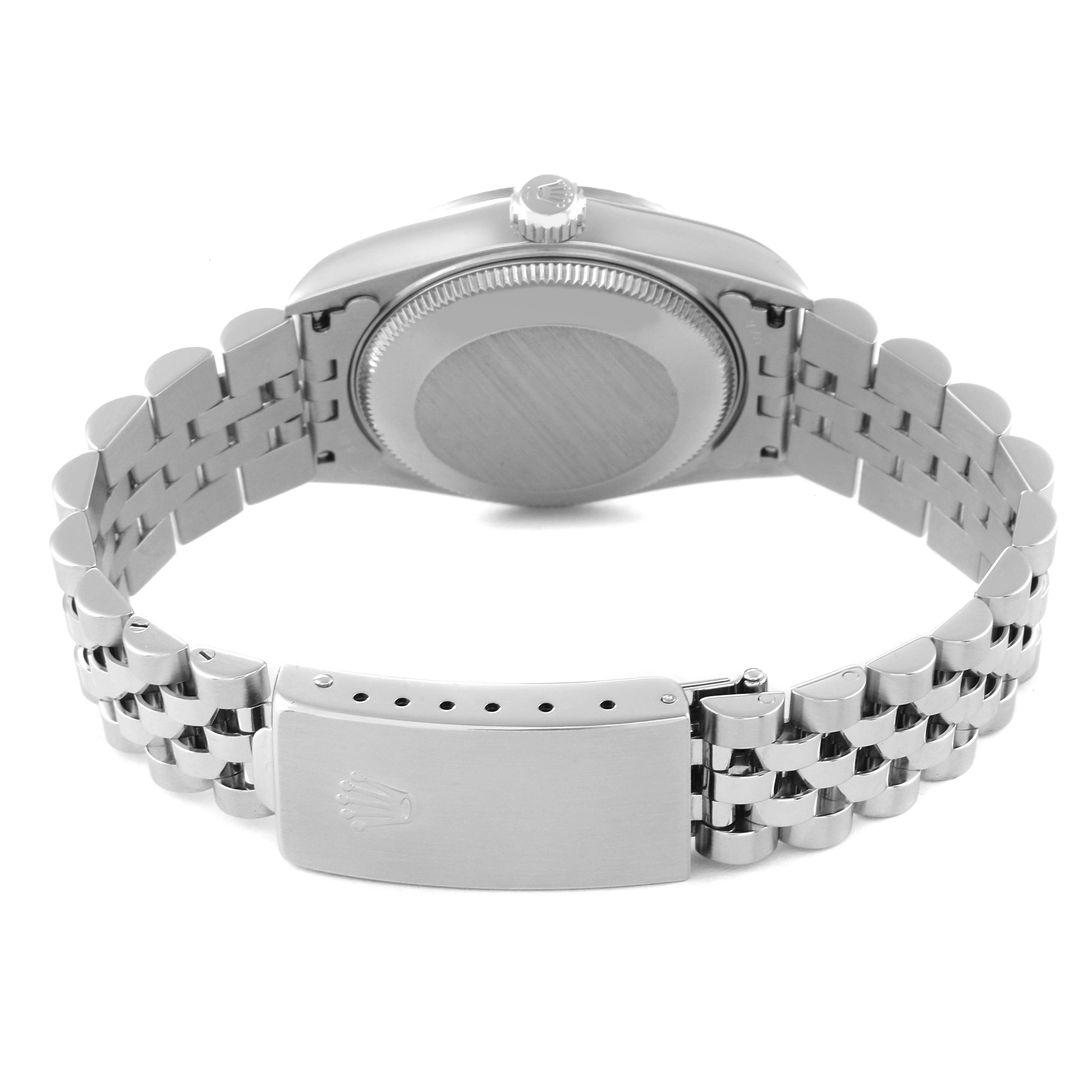 This image shows the back view of a Mid-Size Rolex watch, focusing on the case back, bracelet, and clasp.