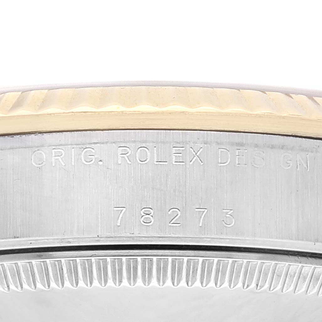 The image shows a close-up of the model number and the bezel of a Mid-Size Rolex watch, displaying the design engraving and number 78273.