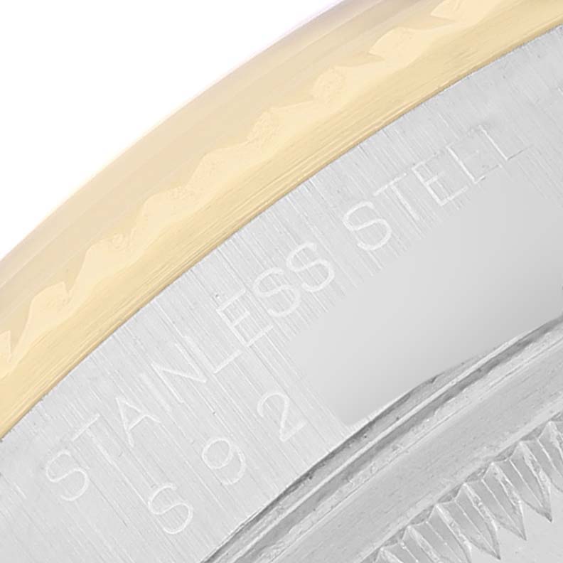 The image shows a close-up of the bezel and side engraving of a Rolex Datejust 16233 Men's Steel and Gold (two tone) Champagne Dial 16233 Men's Steel and Gold (two tone) Champagne Dial watch.