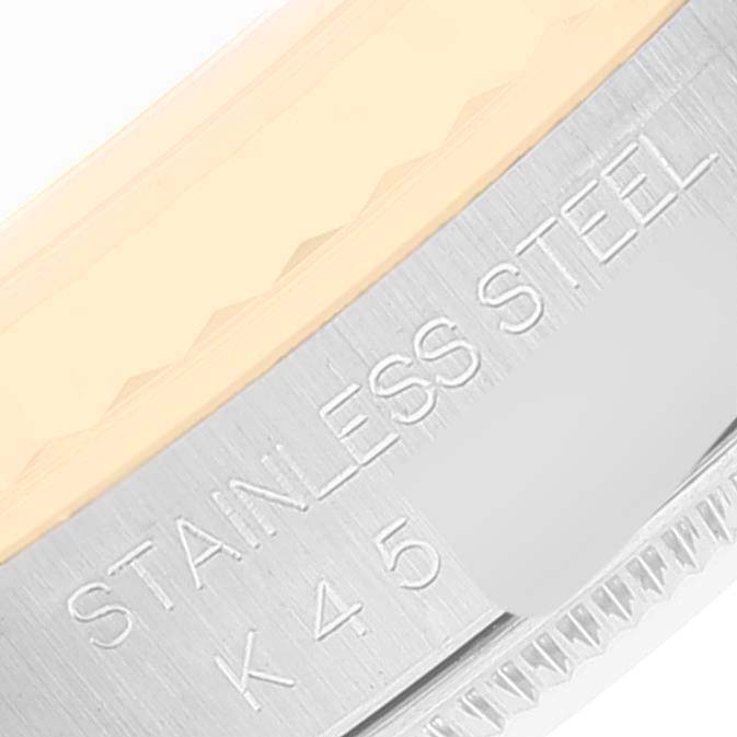 This image shows a close-up of the stainless steel case and engraving on a Rolex Datejust 16233 Men's Steel and Gold (two tone) Champagne Dial 16233 Men's Steel and Gold (two tone) Champagne Dial model watch.