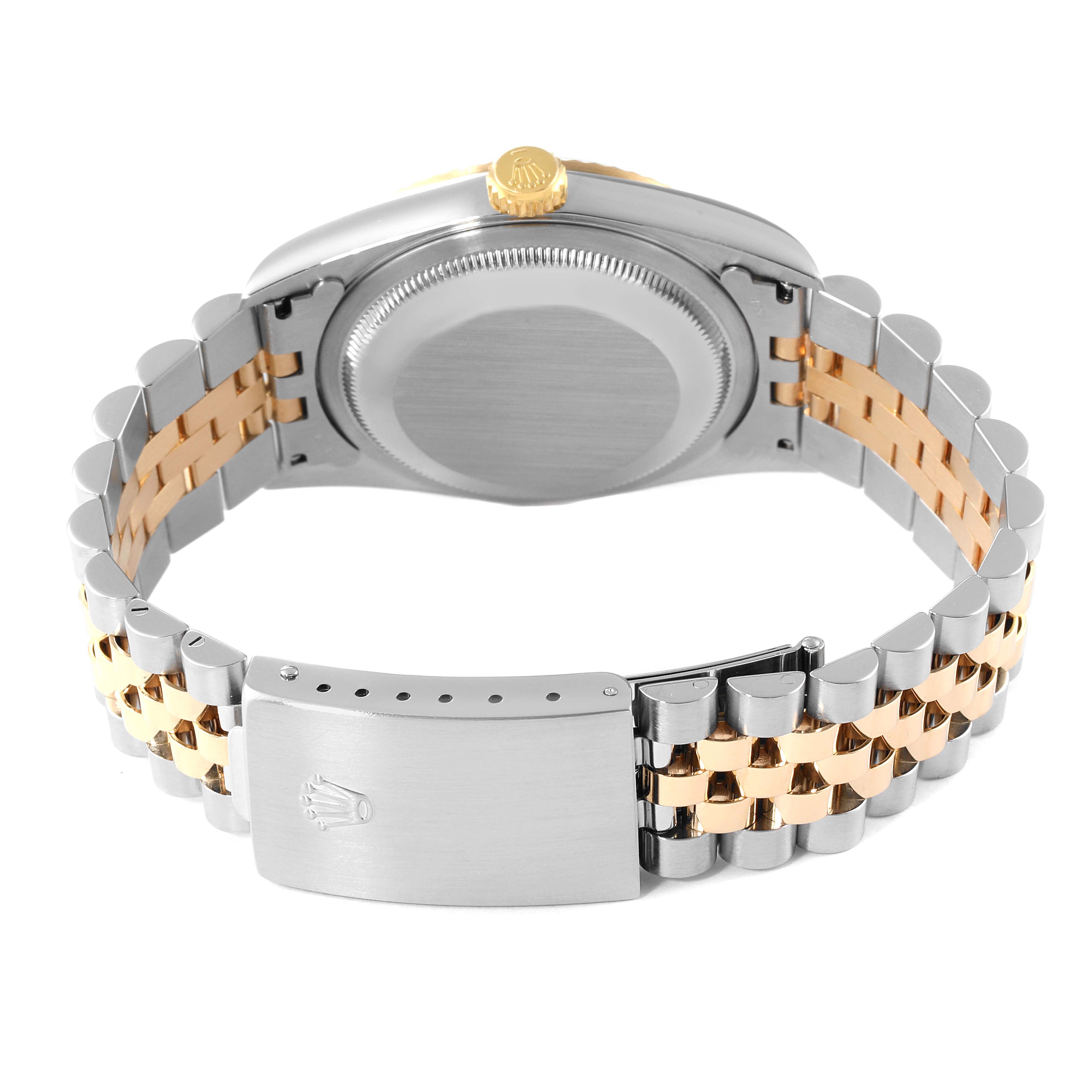 The image shows the back and bracelet of the Rolex Datejust 16233 Men's Steel and Gold (two tone) Champagne Dial 16233 Men's Steel and Gold (two tone) Champagne Dial watch, showcasing its two-tone metal design.