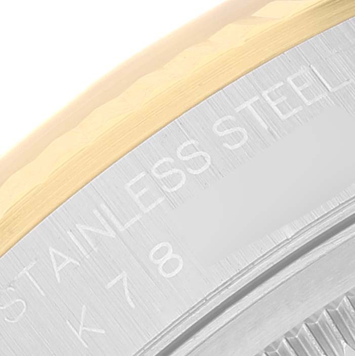 This close-up image shows the case back and part of the bezel of a Rolex Datejust 16233 Men's Steel and Gold (two tone) Silver Dial 16233 Men's Steel and Gold (two tone) Silver Dial watch.