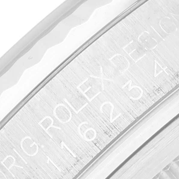 The image shows a close-up of the inner bezel with engravings on a Rolex Datejust 116234 Men's Stainless Steel Blue Dial 116234 Men's Stainless Steel Blue Dial watch.