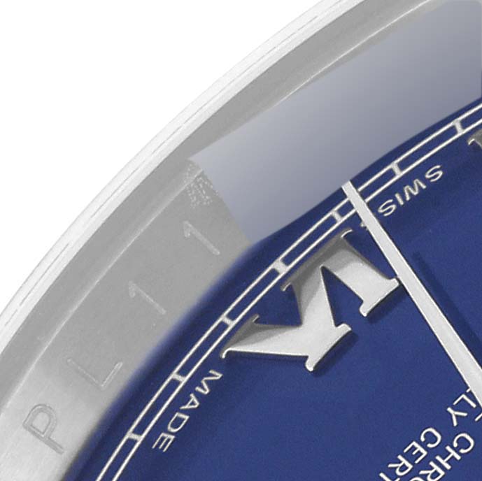 The image shows a close-up of the dial and bezel, featuring a partial view of the markers, from a Rolex Datejust 116234 Men's Stainless Steel Blue Dial 116234 Men's Stainless Steel Blue Dial watch.