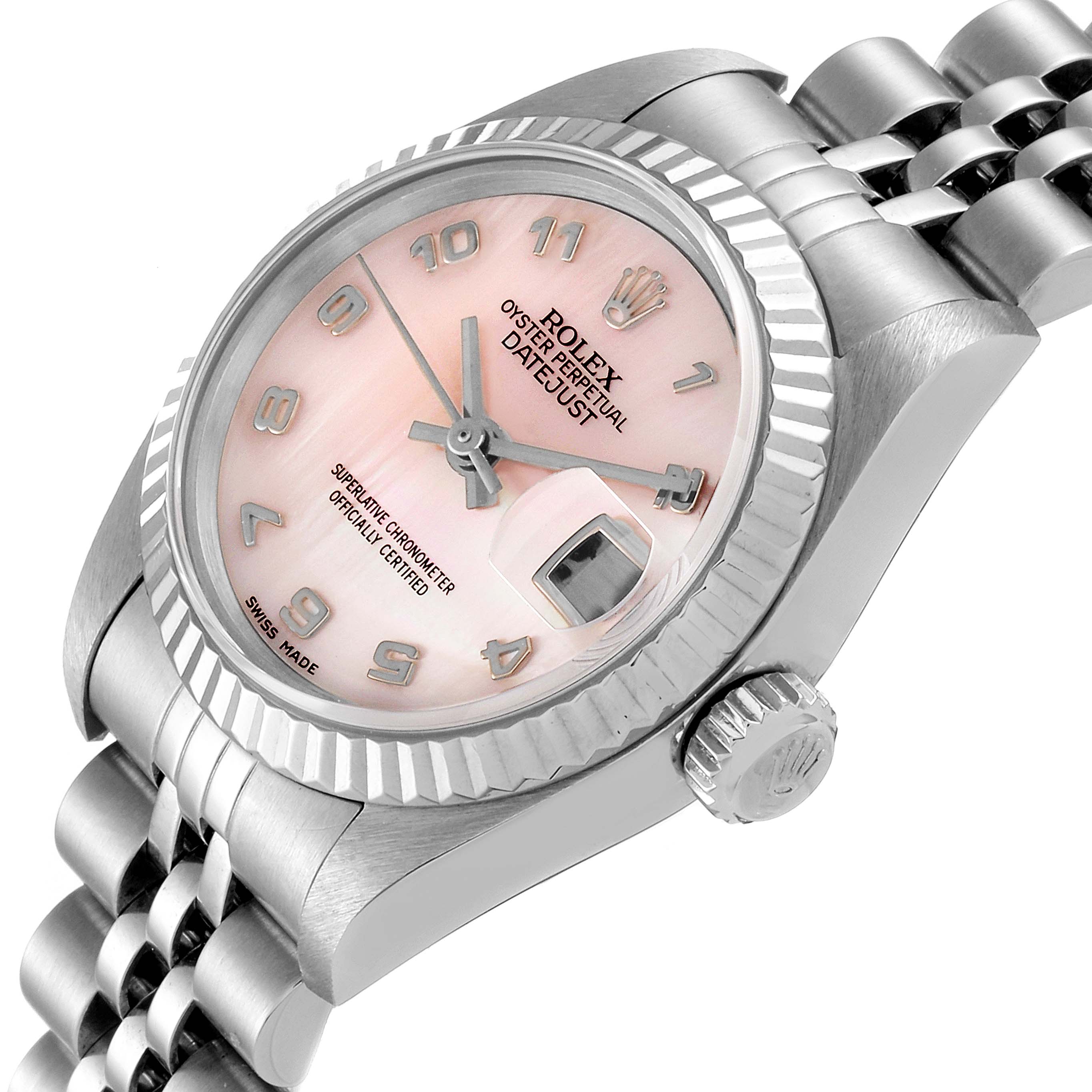 The image shows a close-up of the Rolex Datejust 79174 Women
s Stainless Steel Mother of Pearl Dial 79174 Women
s Stainless Steel Mother of Pearl Dial watch at an angle, displaying the pink face, bezel, crown, and part of the bracelet.