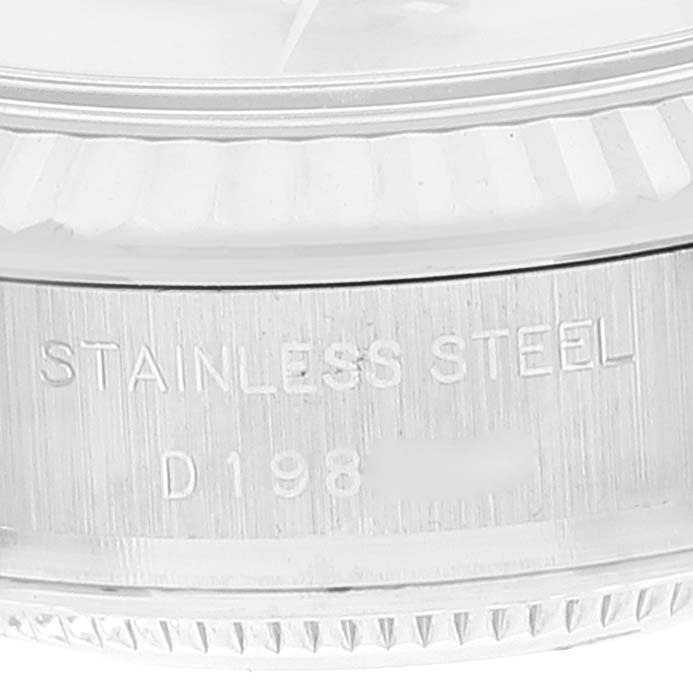 This image shows a close-up of the case side and part of the bezel of a Rolex Datejust 179174 Women's Stainless Steel Silver Dial 179174 Women's Stainless Steel Silver Dial model, with "STAINLESS STEEL" engraved.