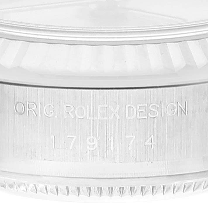This close-up image shows the serial number engraving on the side of a Rolex Datejust 179174 Women's Stainless Steel Silver Dial 179174 Women's Stainless Steel Silver Dial watch.