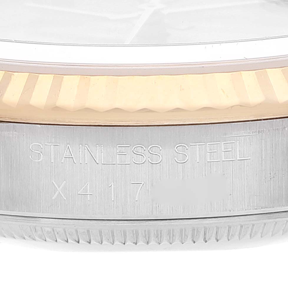 This image shows a close-up of the side of a Rolex Datejust 16233 Men's Steel and Gold (two tone) Champagne Dial 16233 Men's Steel and Gold (two tone) Champagne Dial model, highlighting the stainless steel case and part of the bezel.