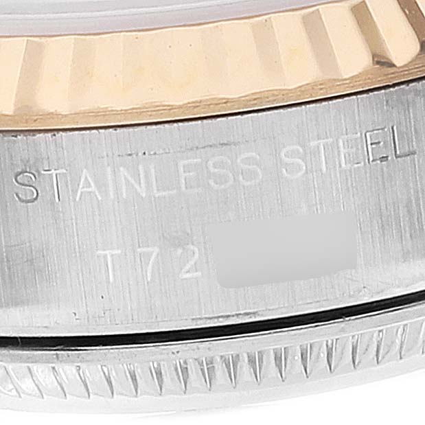 This image shows a close-up of the stainless steel side and fluted bezel of a Rolex Datejust 69173 Women
s Steel and Gold (two tone) White Dial 69173 Women
s Steel and Gold (two tone) White Dial watch.