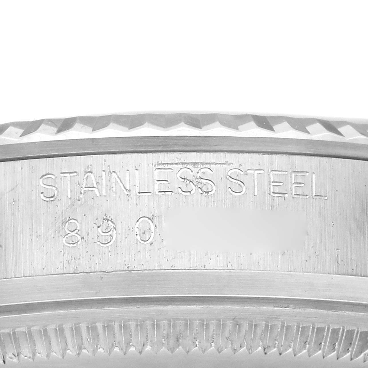 This image shows a close-up of the stainless steel case with engraved text for the Rolex Datejust 16014 Men's Stainless Steel Black Dial 16014 Men's Stainless Steel Black Dial watch.