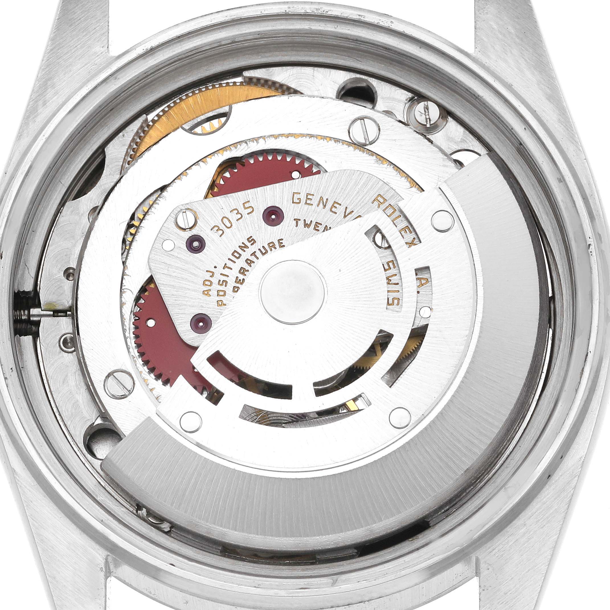 This image shows the back view of a Rolex Datejust 16014 Men's Stainless Steel Black Dial 16014 Men's Stainless Steel Black Dial watch, highlighting the internal movement mechanism.