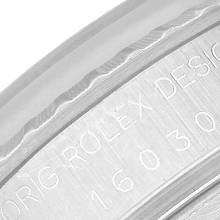 This close-up image of the Rolex Datejust 16030 Men's Stainless Steel White Dial 16030 Men's Stainless Steel White Dial watch shows the engravings on the inner bezel.