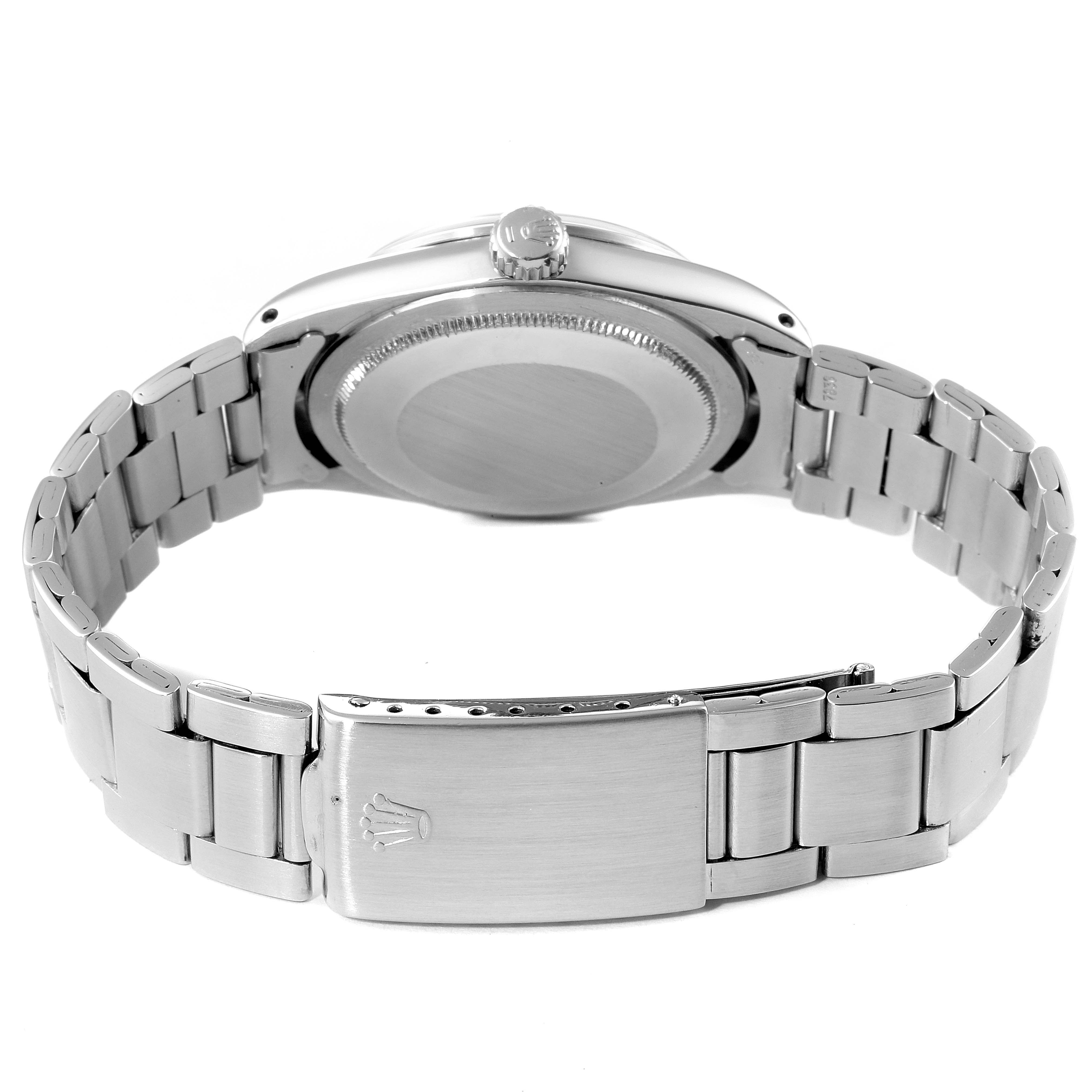 The image shows the back case, crown, and bracelet clasp of the Vintage Collection Rolex watch.