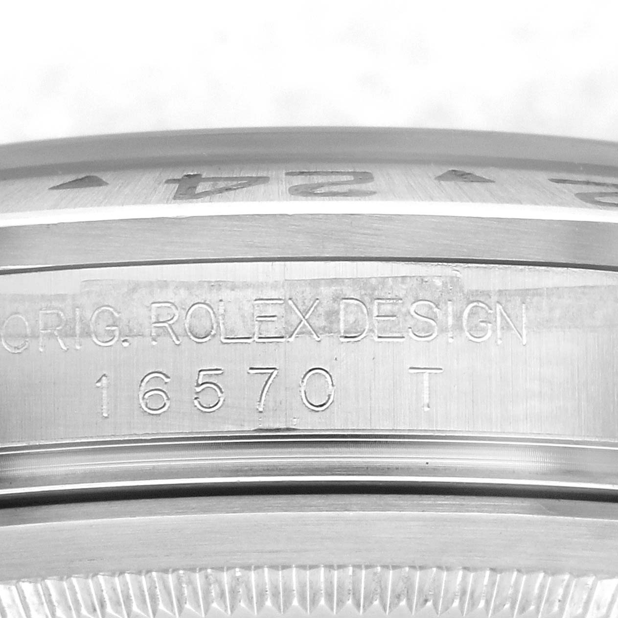 The close-up image shows the engraved side of the Rolex Explorer 16570 Men's Stainless Steel Black Dial 16570 Men's Stainless Steel Black Dial model 16570 T.