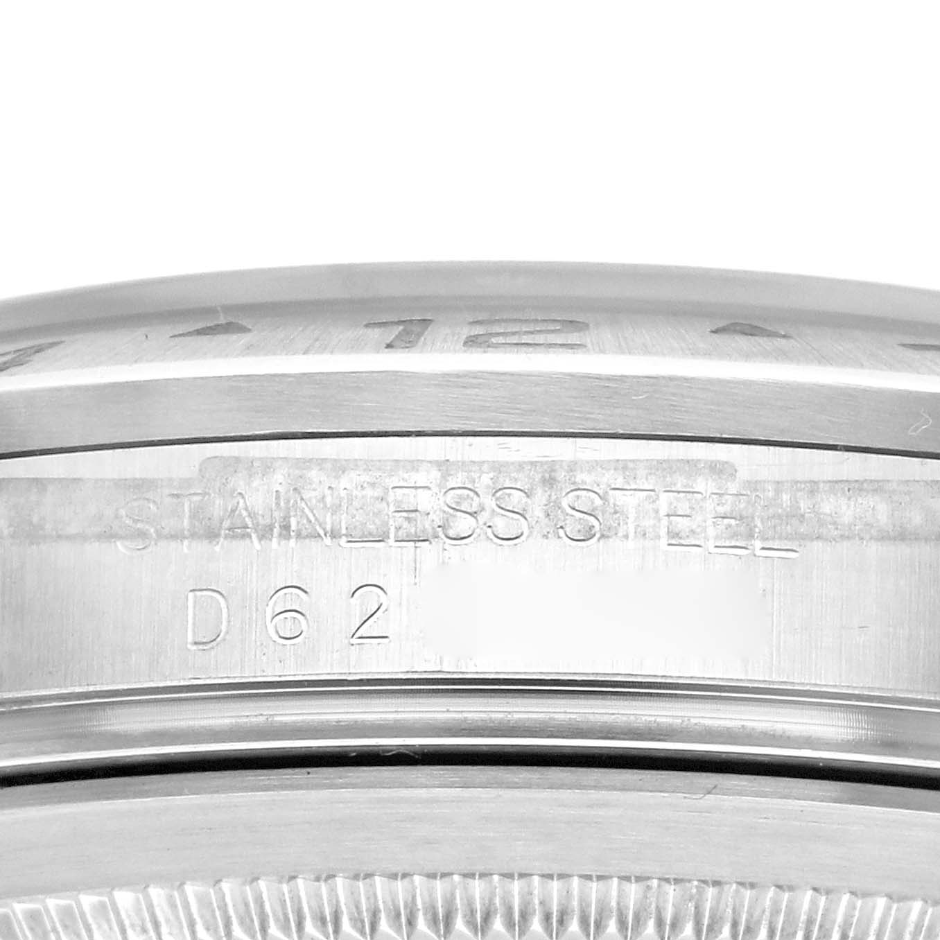 This image shows a close-up of the side of the stainless steel case of a Rolex Explorer 16570 Men's Stainless Steel Black Dial 16570 Men's Stainless Steel Black Dial watch, displaying the material and model code.