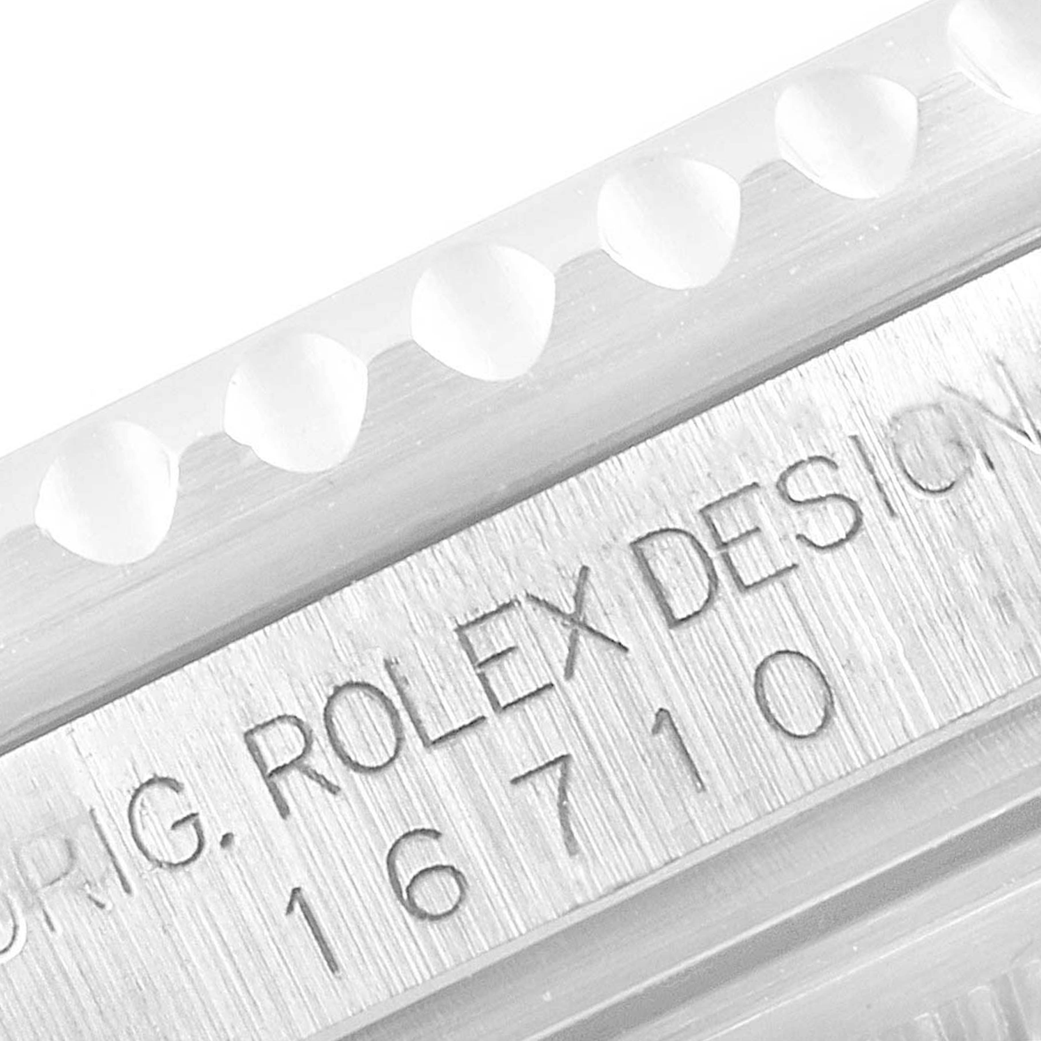 This close-up image shows the engraved model number "16710" on the side of a Rolex GMT-Master 16710 Men
s Stainless Steel Black Dial 16710 Men
s Stainless Steel Black Dial watch case with part of the bezel edge visible.