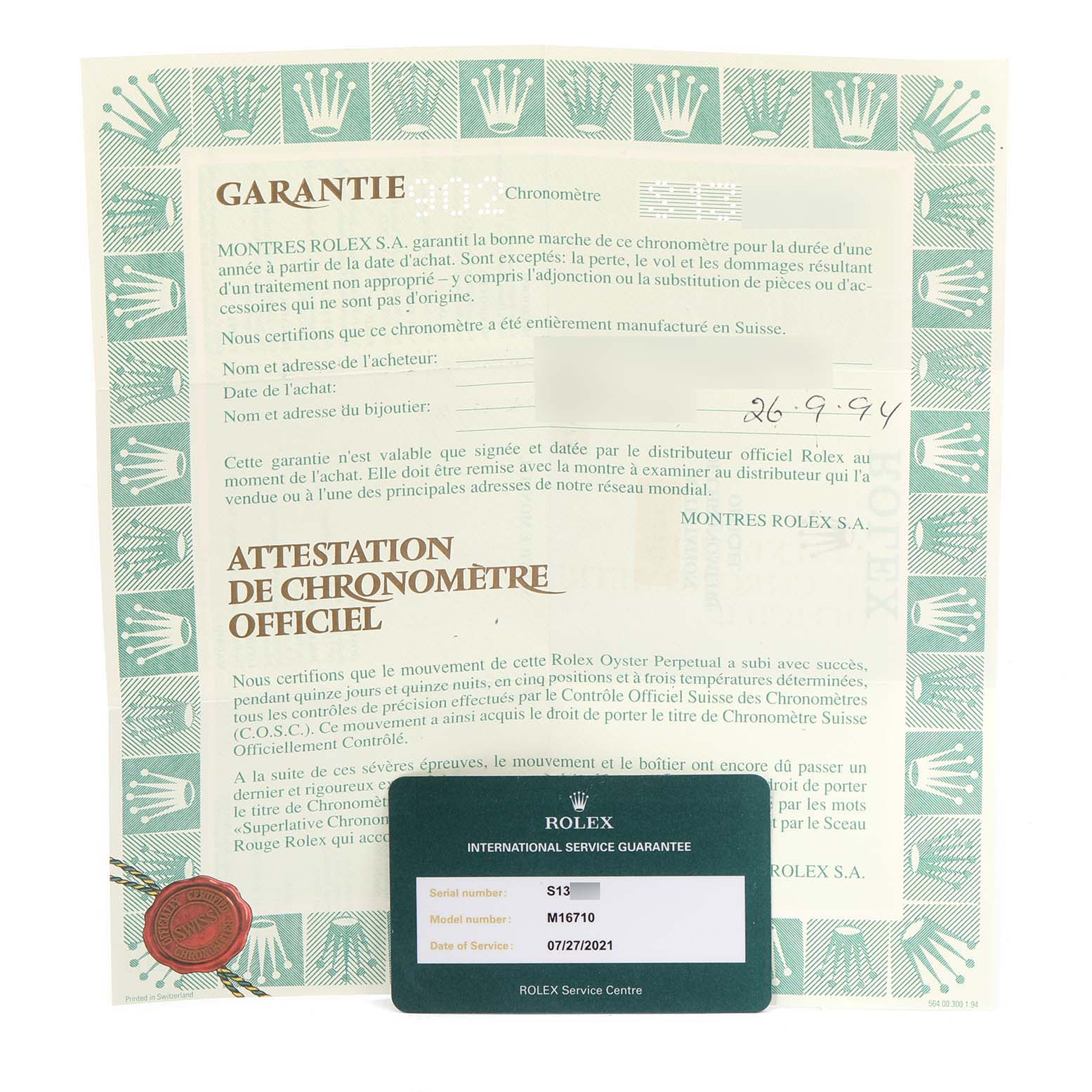 The image shows the warranty certificate and the international service guarantee card for a Rolex GMT-Master 16710 Men
s Stainless Steel Black Dial 16710 Men
s Stainless Steel Black Dial model watch.