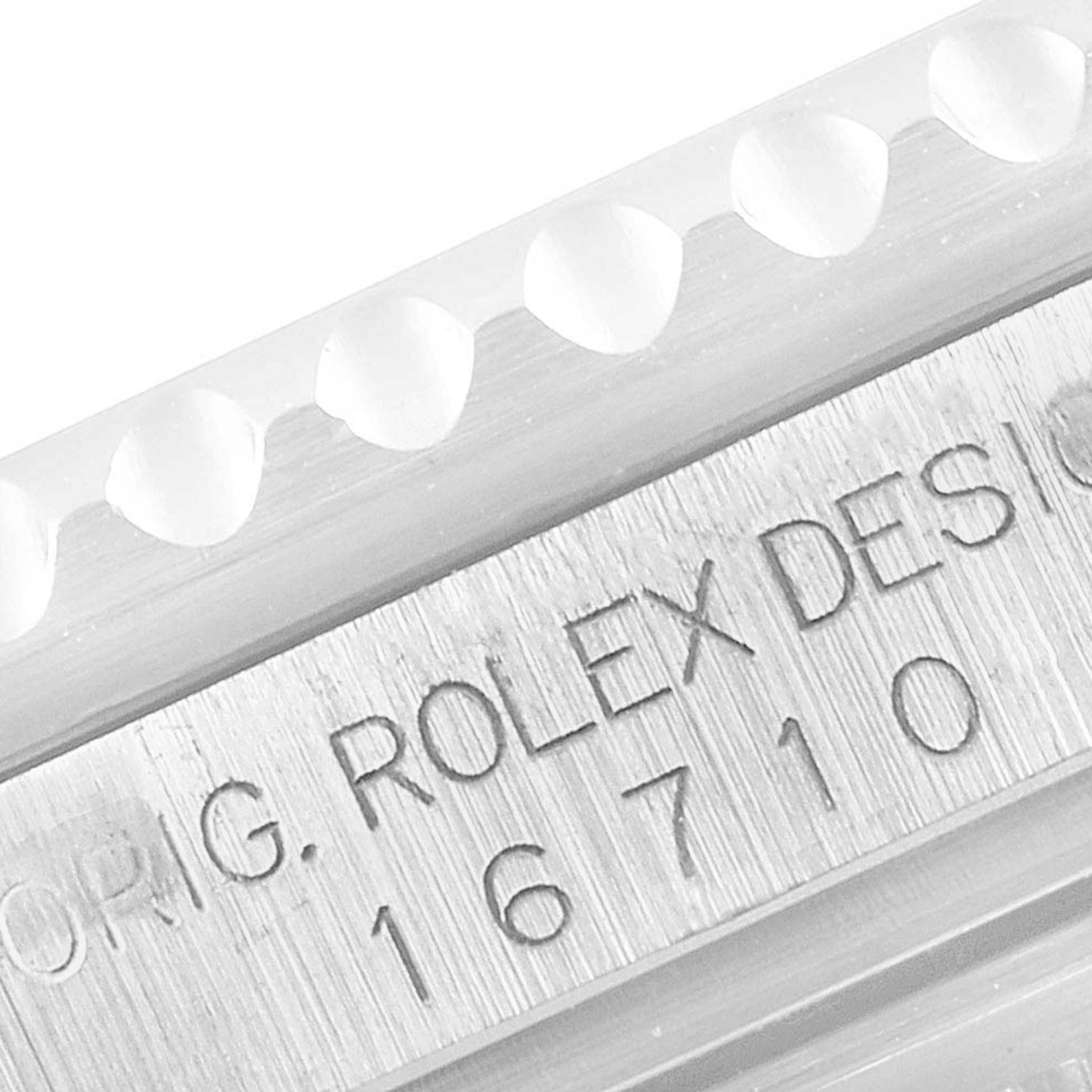 This close-up image shows the engraved model number "16710" on the side of a Rolex GMT-Master 16710 Men
s Stainless Steel Black Dial 16710 Men
s Stainless Steel Black Dial watch case.