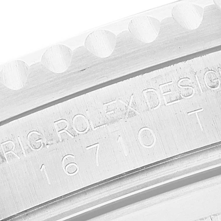 This is a close-up of the engraved model number and "Rolex Design" text on the case of a Rolex GMT-Master 16710 Men
s Stainless Steel Black Dial 16710 Men
s Stainless Steel Black Dial watch.
