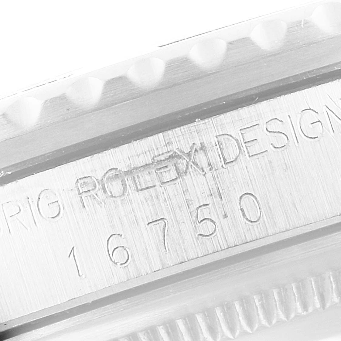 This close-up image shows the serial number and design engraving on the case side of the Vintage Collection Rolex watch model 16750.