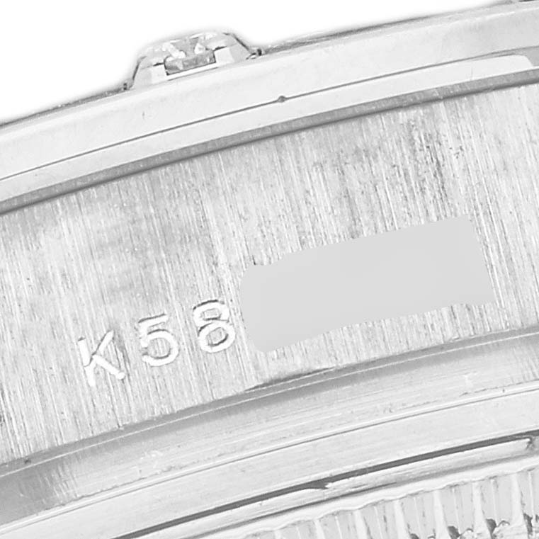 The image shows a close-up of the side engraving on the case of a Rolex Pearlmaster 80319 Women's White Gold Mother of Pearl Dial 80319 Women's White Gold Mother of Pearl Dial watch.