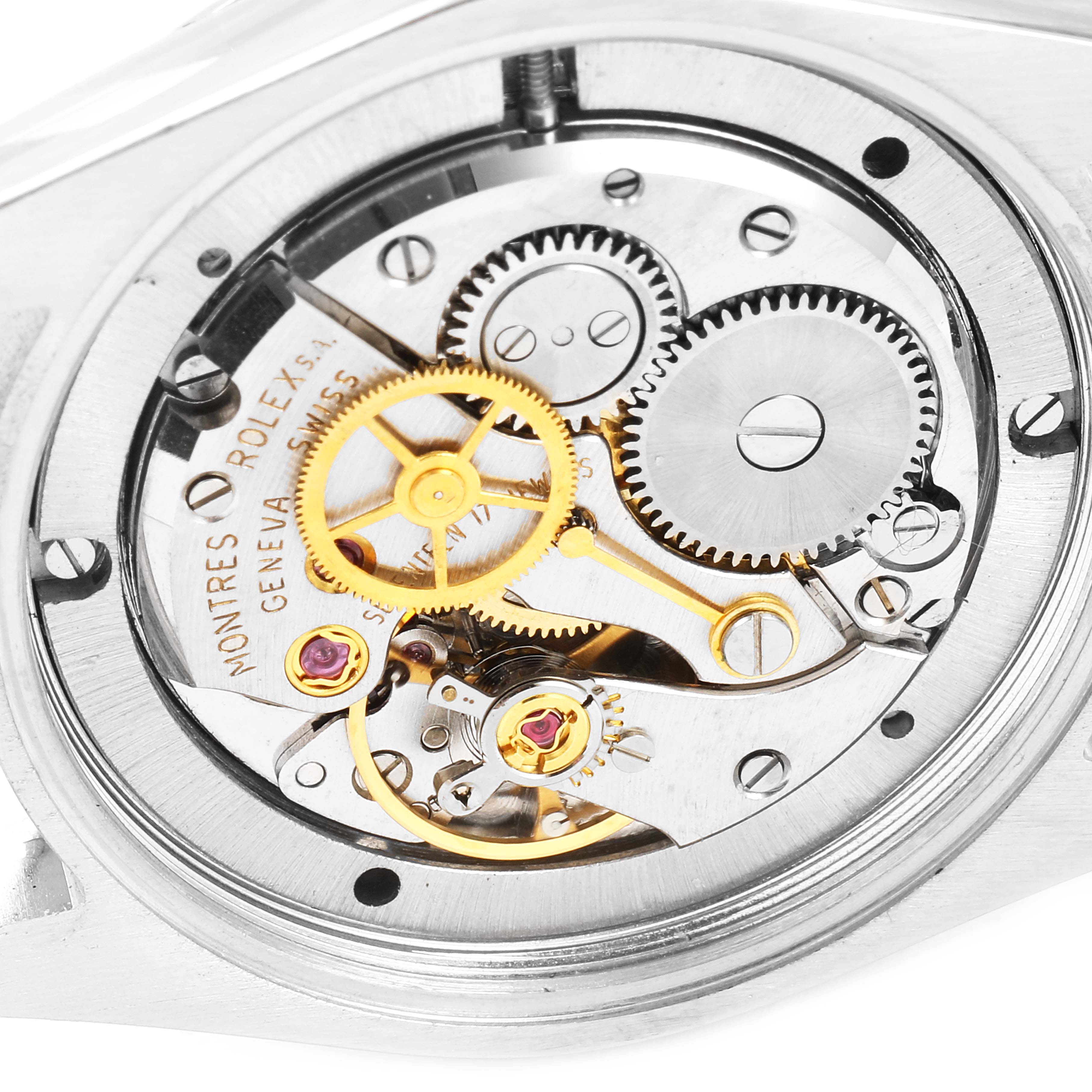 This close-up image of a Rolex Vintage Collection 6694 Men
s Stainless Steel Silver Dial 6694 Men
s Stainless Steel Silver Dial watch shows its intricate movement and internal gears.