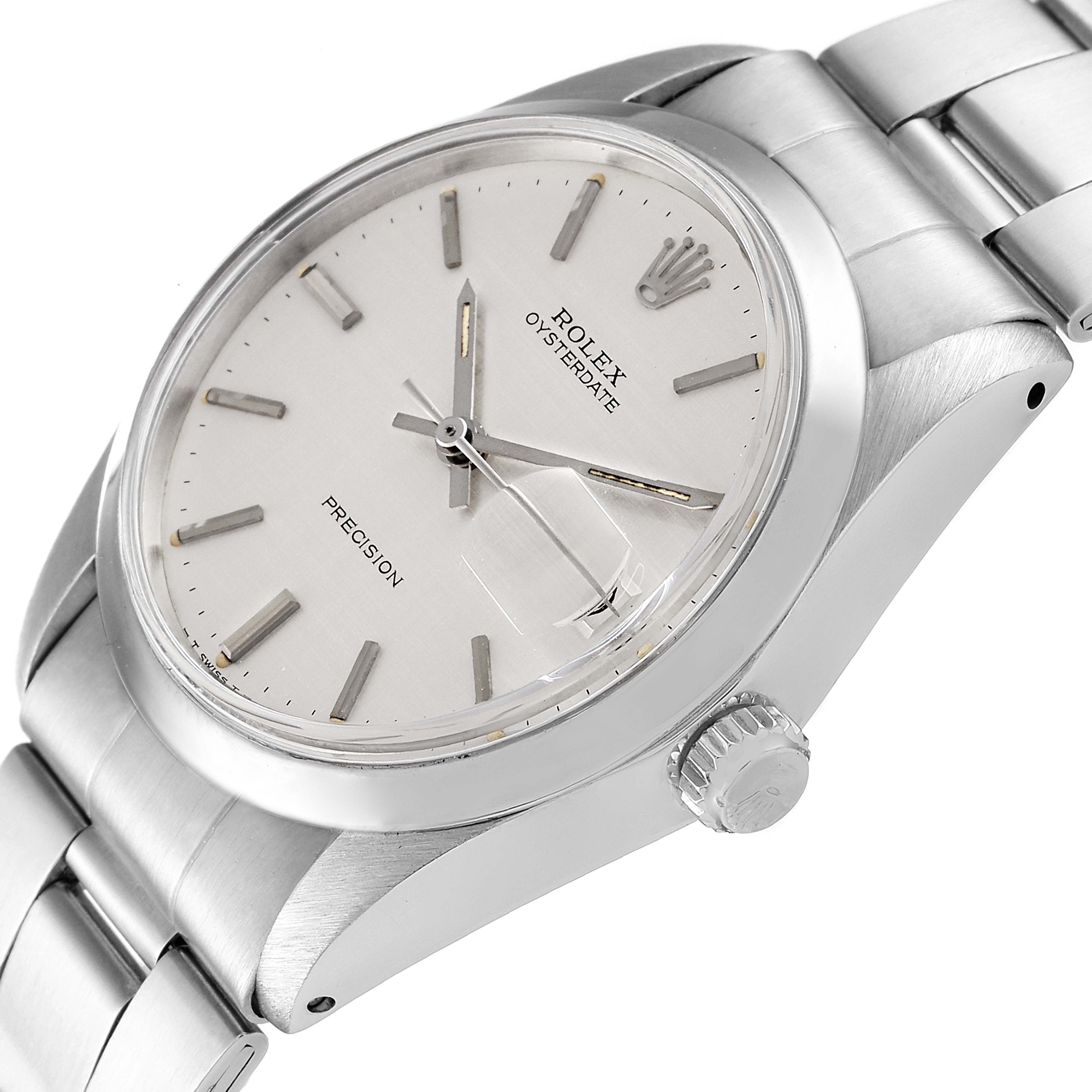 The image shows a close-up, angled view of the Rolex Vintage Collection 6694 Men
s Stainless Steel Silver Dial 6694 Men
s Stainless Steel Silver Dial Oysterdate watch, highlighting the dial and crown.