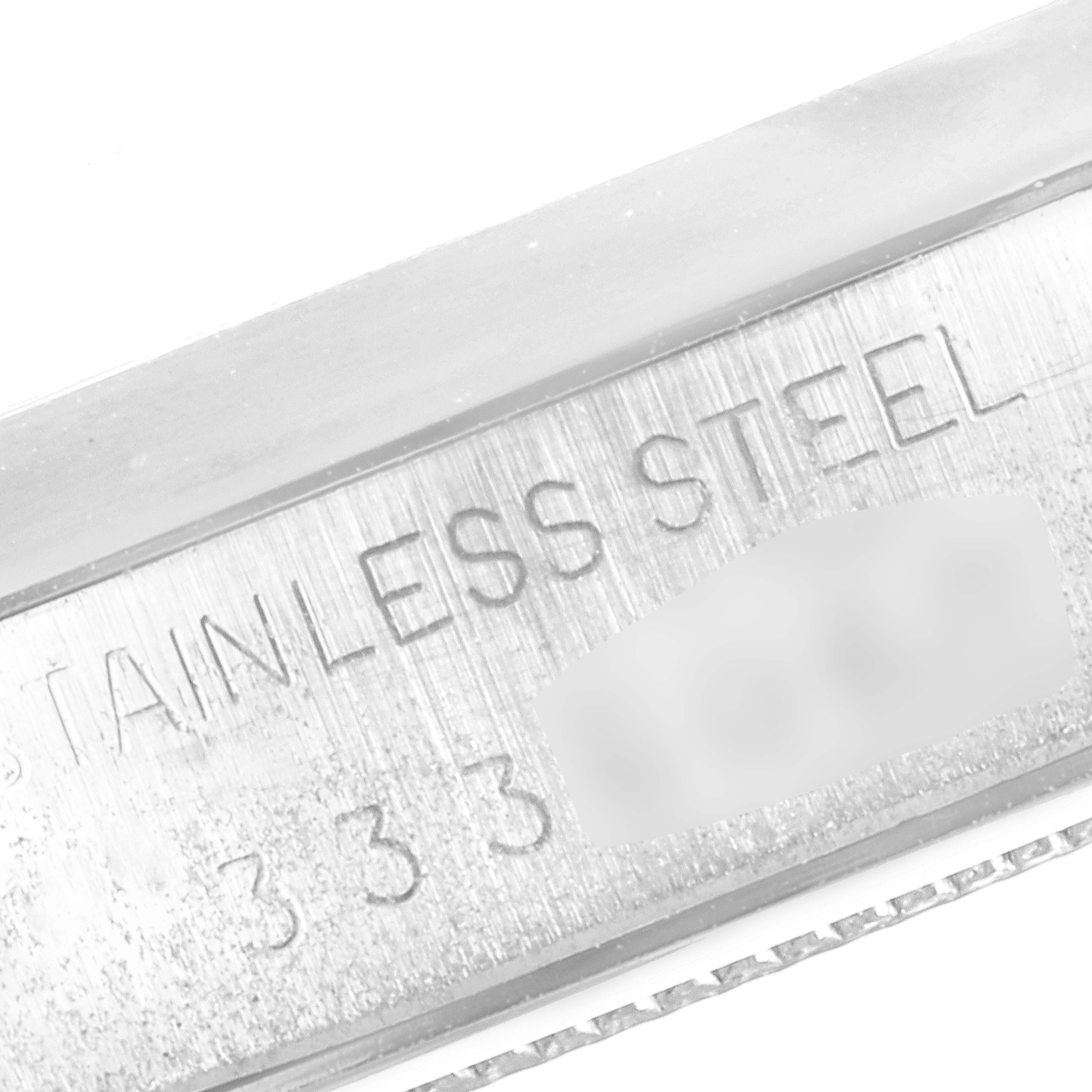 This close-up image shows the bezel of the Vintage Collection Rolex, featuring stainless steel engraving.