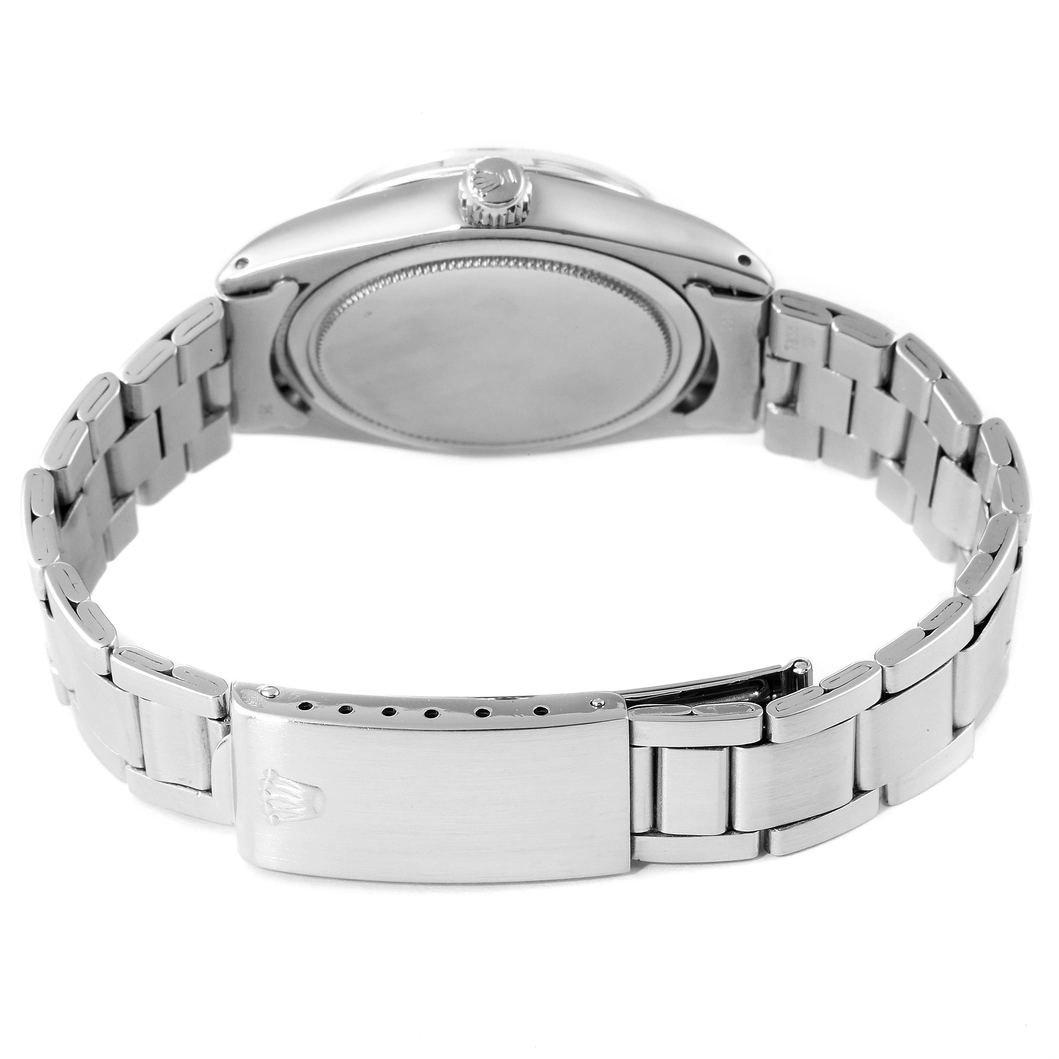 The image shows the back view of the Rolex Vintage Collection 6694 Men
s Stainless Steel Silver Dial 6694 Men
s Stainless Steel Silver Dial watch, highlighting the case back, crown, and part of the bracelet.