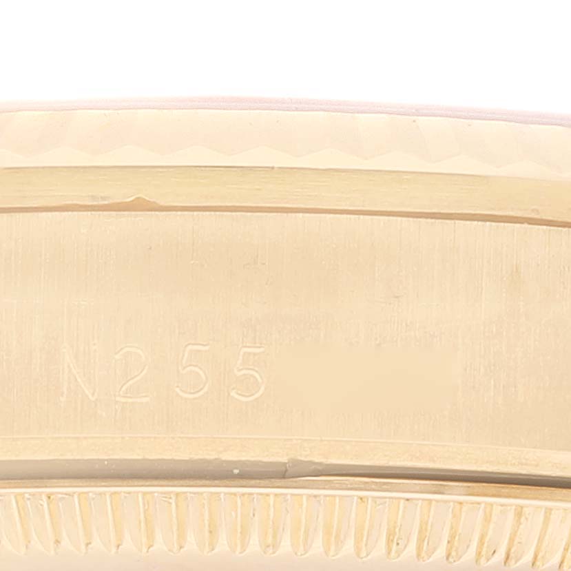 This image shows a close-up of the side details and engraved serial number area of a Rolex President 68278 Women's Yellow Gold White Dial 68278 Women's Yellow Gold White Dial model watch.