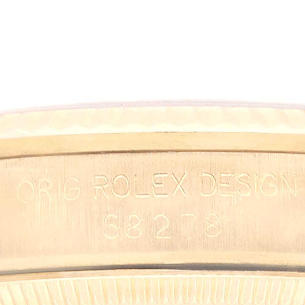 The image shows a close-up of the case side of a Rolex President 68278 Women's Yellow Gold White Dial 68278 Women's Yellow Gold White Dial model, displaying the engraved text "ORIG ROLEX DESIGN" and the model number 68278.