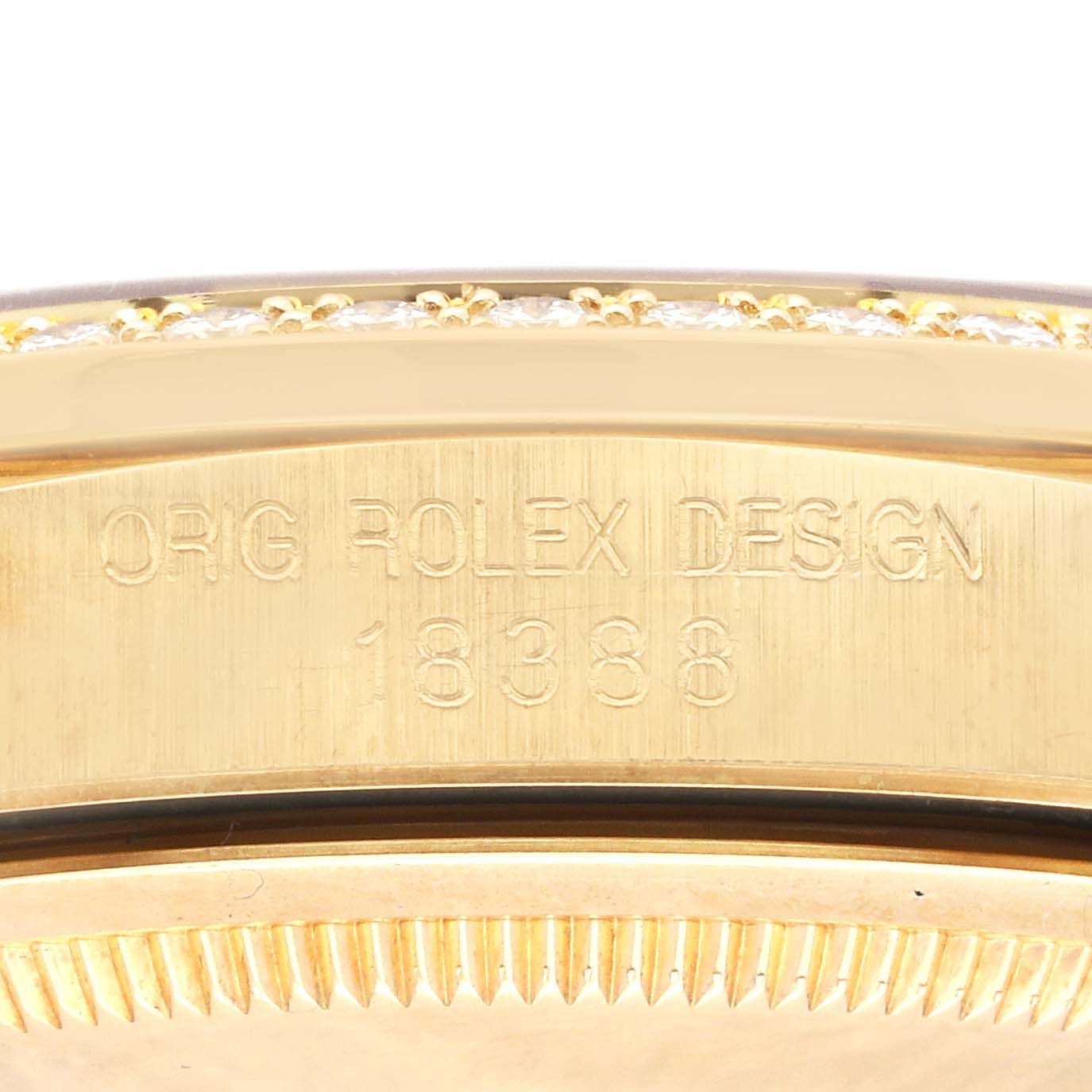 This close-up image shows the engraved side of the case back of the Rolex President 18388 Men's Yellow Gold Black Dial 18388 Men's Yellow Gold Black Dial model, displaying "ORG ROLEX DESIGN" and the model number "18388".